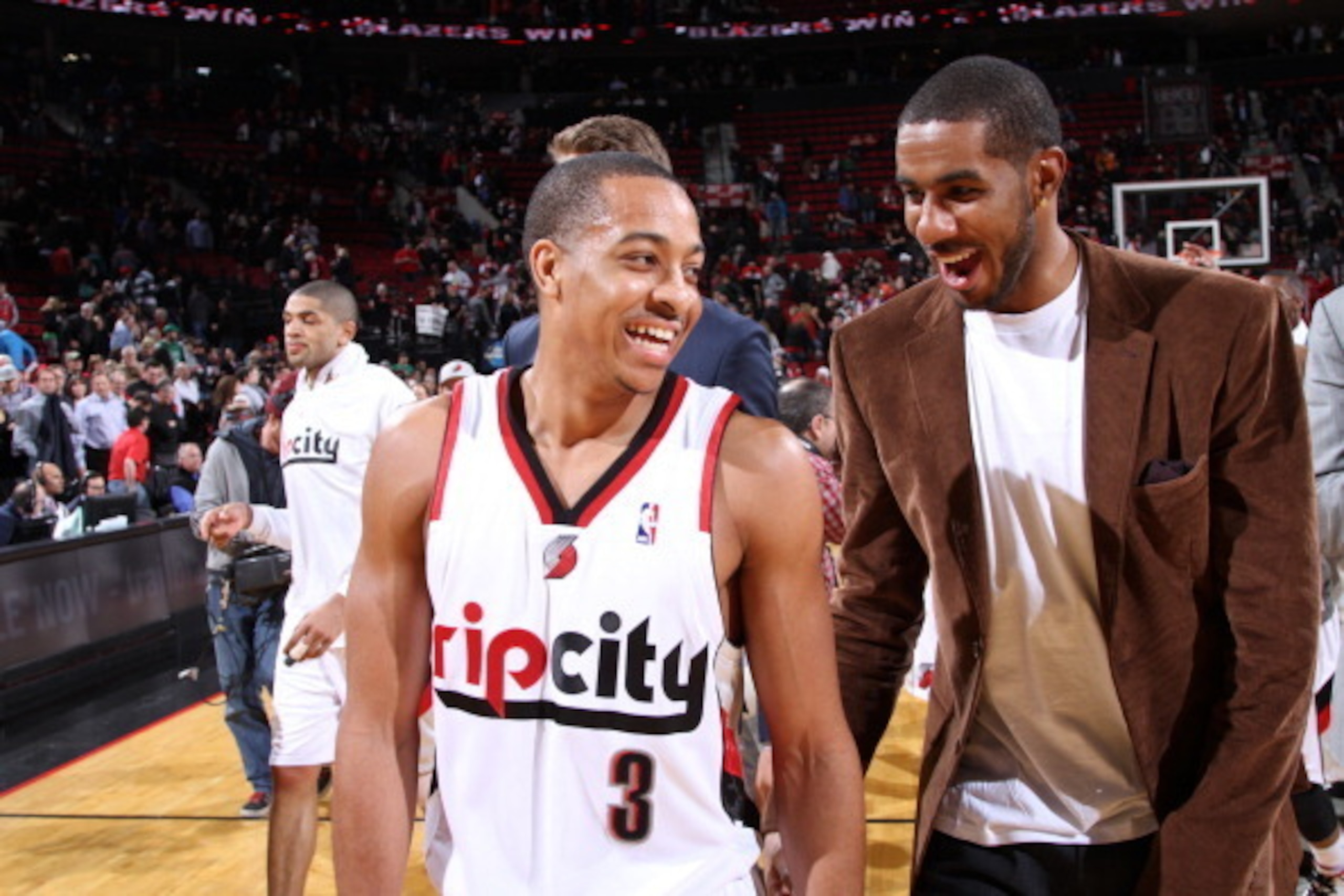 PORTLAND, OR - FEBRUARY 26:  C.J. McCollum #3 and LaMarcus Aldridge #12 of the Portland Trail Blazers smile and walk off the court after the game against the Brooklyn Nets on February 26, 2014 at the Moda Center Arena in Portland, Oregon. NOTE TO USER: Us