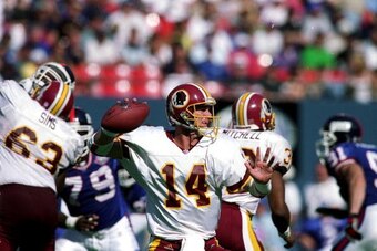 19 Sep 1999:  Brad Johnson #14 of the Washington Redskins gets ready to pass the ball during a game against the New York Giants at the Giants Stadium in East Rutherford, New Jersey. The Redskins defeated the Giants 50-21. Mandatory Credit: Ezra O. Shaw  /