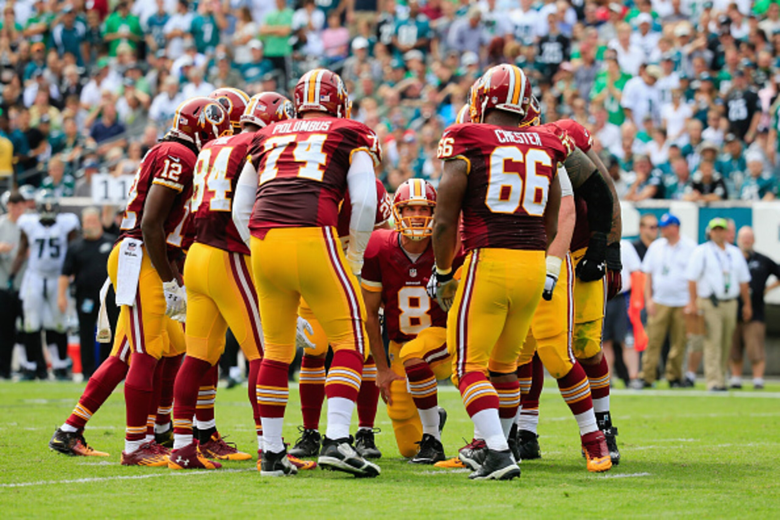 PHILADELPHIA, PA - SEPTEMBER 21: Quarterback Kirk Cousins #8 of the Washington Redskins talks with the team before playing against the Philadelphia Eagles at the start of the game at Lincoln Financial Field on September 21, 2014 in Philadelphia, Pennsylva