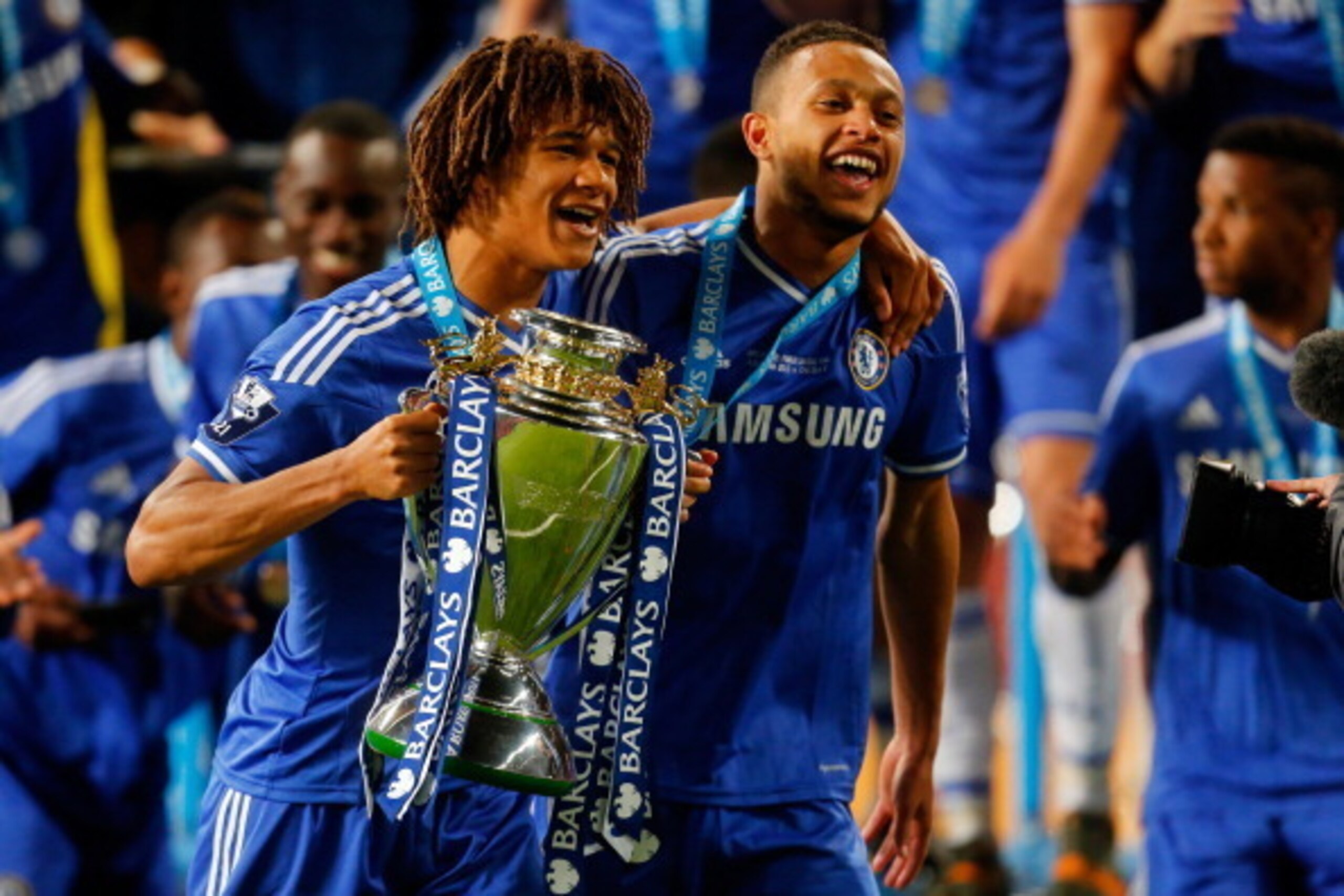 MANCHESTER, ENGLAND - MAY 14: Nathan Ake (L) and Lewis Baker of Chelsea celebrate with the trophy after the Barclays Under-21 Premier League Final match between Manchester United and Chelsea at Old Trafford on May 14, 2014 in Manchester, England. (Photo b