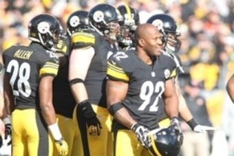 December 23, 2012; Pittsburgh, PA, USA; Pittsburgh Steelers outside linebacker James Harrison (92) reacts during a time-out against the Cincinnati Bengals during the first quarter at Heinz Field. The Cincinnati Bengals won 13-10. Mandatory Credit: Charles