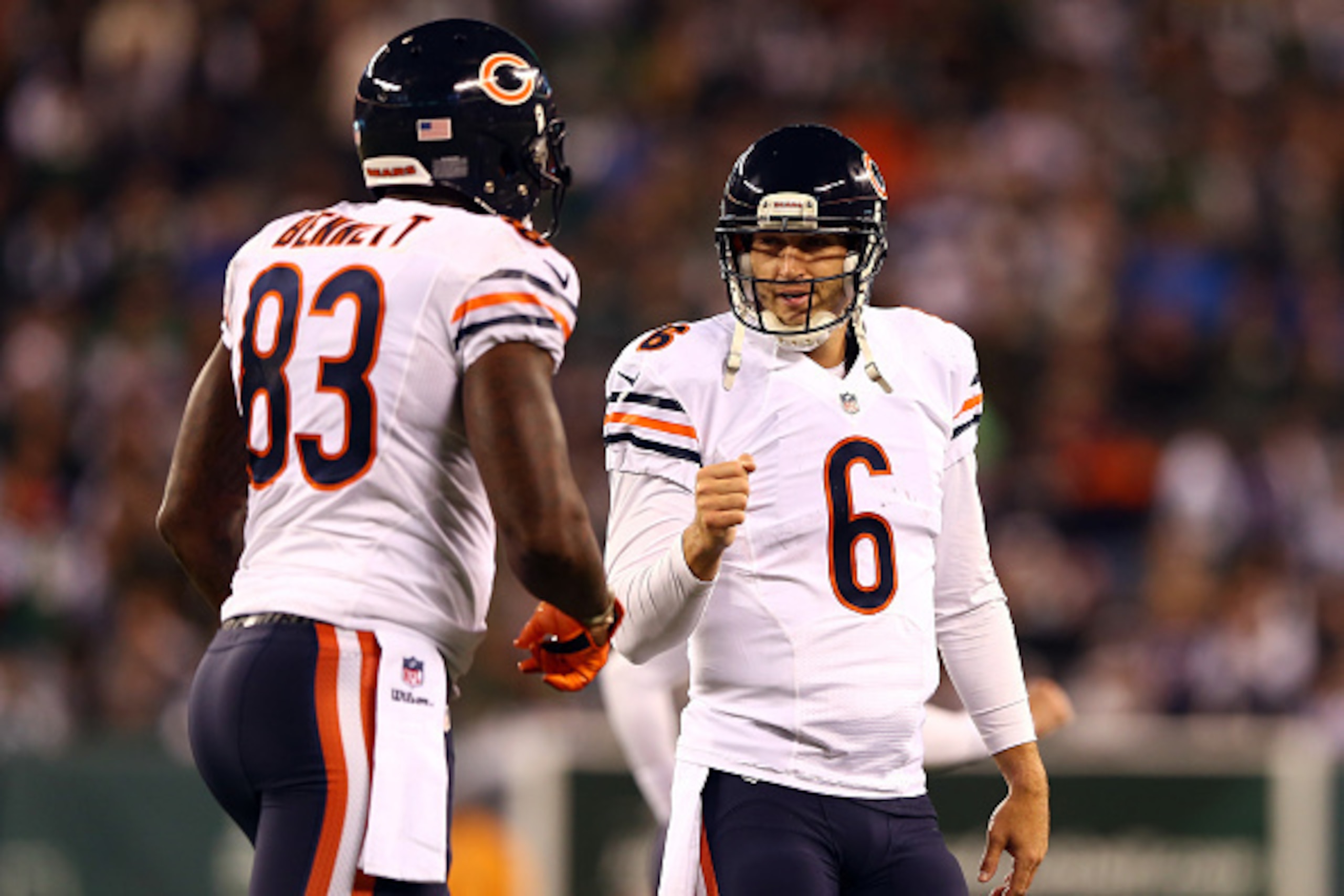 EAST RUTHERFORD, NJ - SEPTEMBER 22:  Quarterback Jay Cutler #6 celebrates a touchdown with tight end Martellus Bennett #83 of the Chicago Bears against the New York Jets during a game at MetLife Stadium on September 22, 2014 in East Rutherford, New Jersey