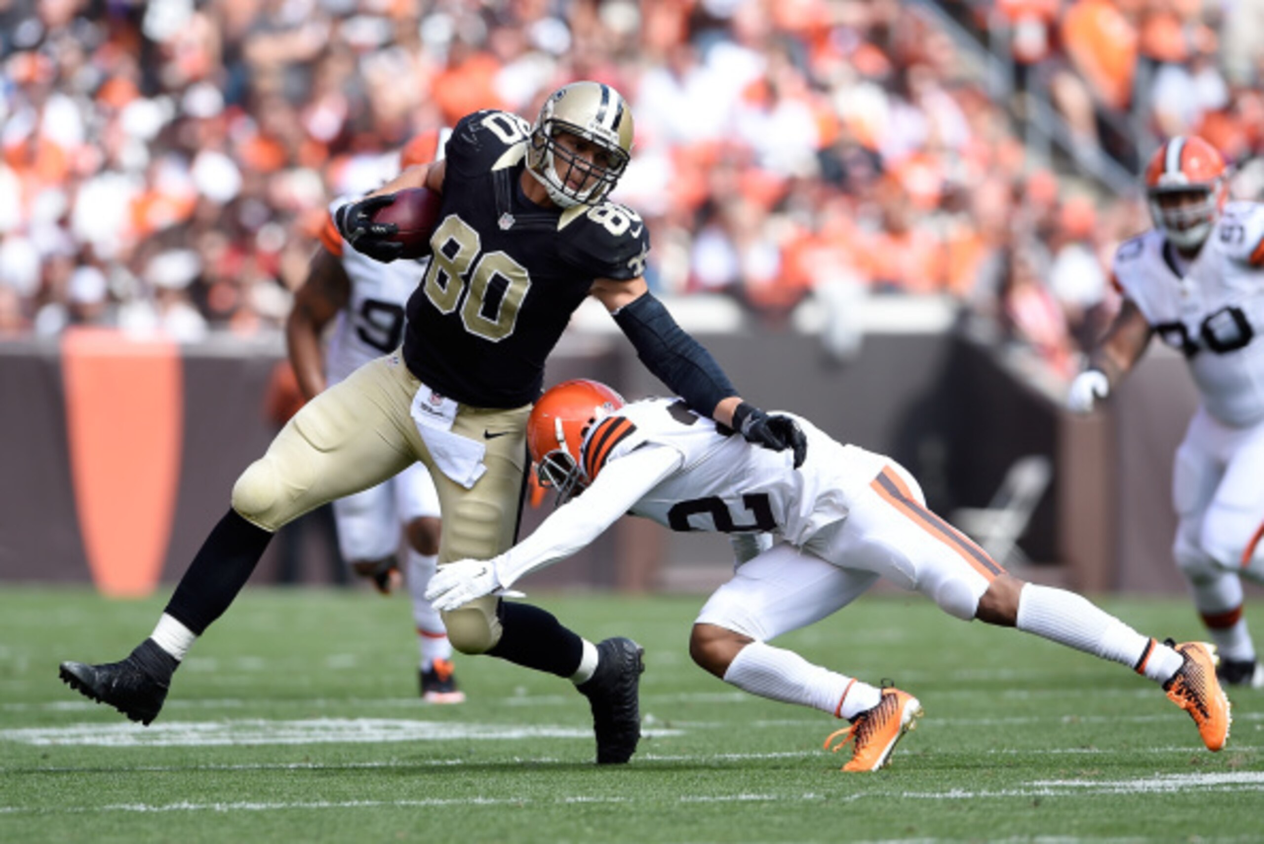 CLEVELAND, OH - SEPTEMBER 14:  Jimmy Graham #80 of the New Orleans Saints avoids a tackle by Buster Skrine #22 of the Cleveland Browns during the second quarter at FirstEnergy Stadium on September 14, 2014 in Cleveland, Ohio.  (Photo by Jason Miller/Getty