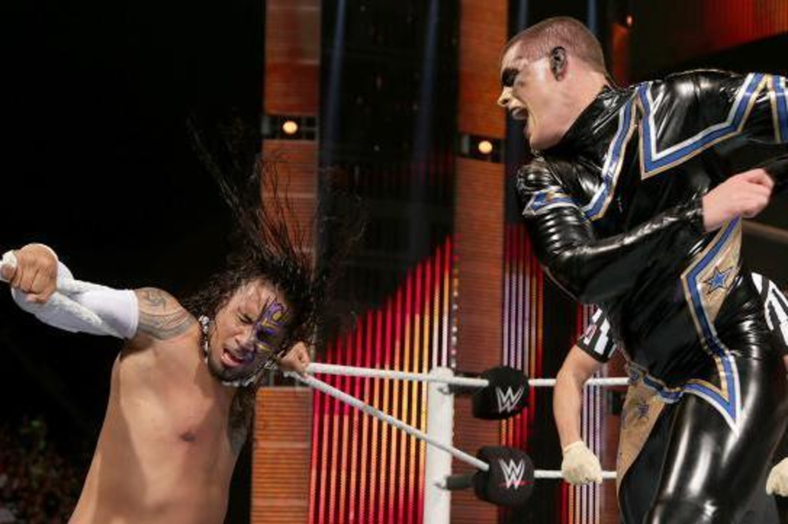 Stardust slaps Jimmy Uso.