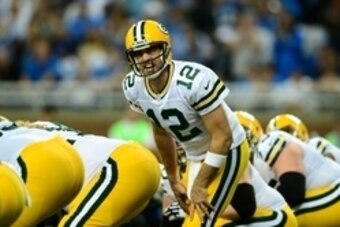 Sep 21, 2014; Detroit, MI, USA; Green Bay Packers quarterback Aaron Rodgers (12) gestures at the line of scrimmage during the second quarter against the Detroit Lions at Ford Field. Mandatory Credit: Andrew Weber-USA TODAY Sports