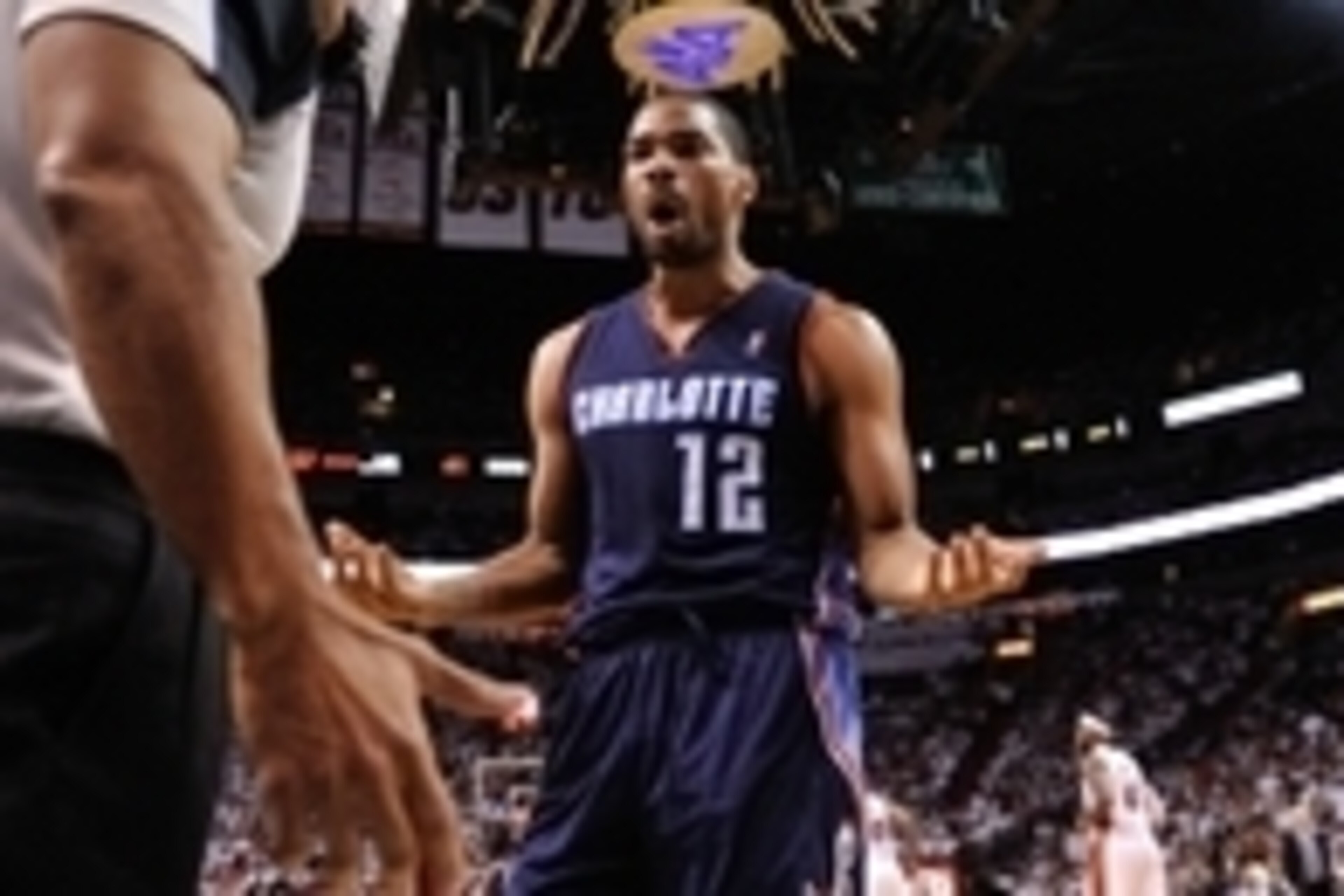 Apr 23, 2014; Miami, FL, USA; Charlotte Bobcats guard Gary Neal (right) questions a call from referee Bill Kennedy (left) against the Miami Heat in game two during the first round of the 2014 NBA Playoffs at American Airlines Arena. Mandatory Credit: Stev