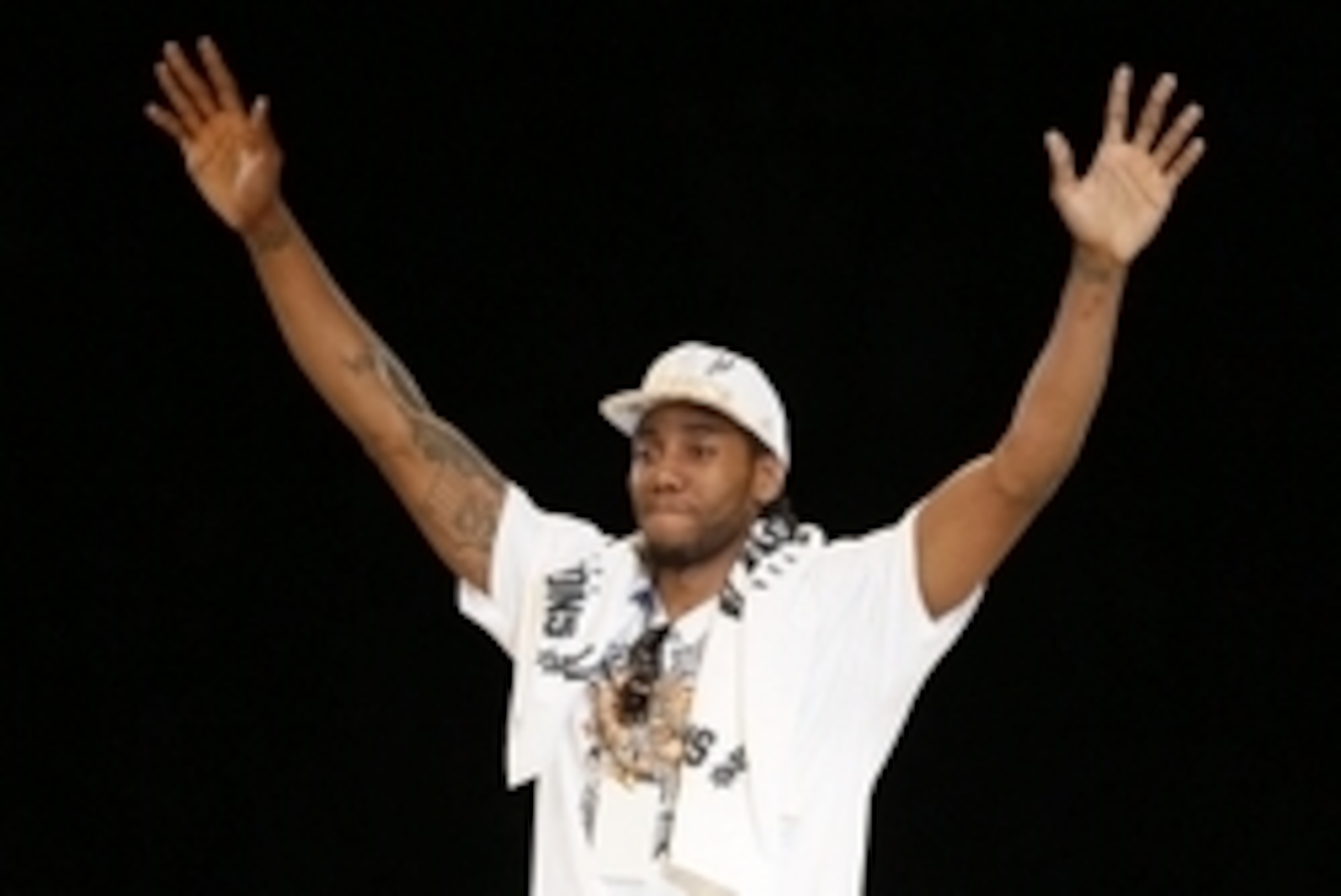 Jun 18, 2014; San Antonio, TX, USA; San Antonio Spurs forward Kawhi Leonard (2) waves to the crowd during NBA championship celebrations at Alamodome. Mandatory Credit: Soobum Im-USA TODAY Sports Jun 18, 2014; San Antonio, TX, USA; San Antonio Spurs forward Kawhi Leonard (2) waves to the crowd during NBA championship celebrations at Alamodome. Mandatory Credit: Soobum Im-USA TODAY Sports