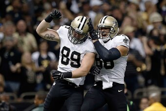 NEW ORLEANS, LA - SEPTEMBER 21:  Josh Hill and Jimmy Graham #80 of the New Orleans Saints celebrate a touchdown during the first quarter of a game against the Minnesota Vikings at the Mercedes-Benz Superdome on September 21, 2014 in New Orleans, Louisiana