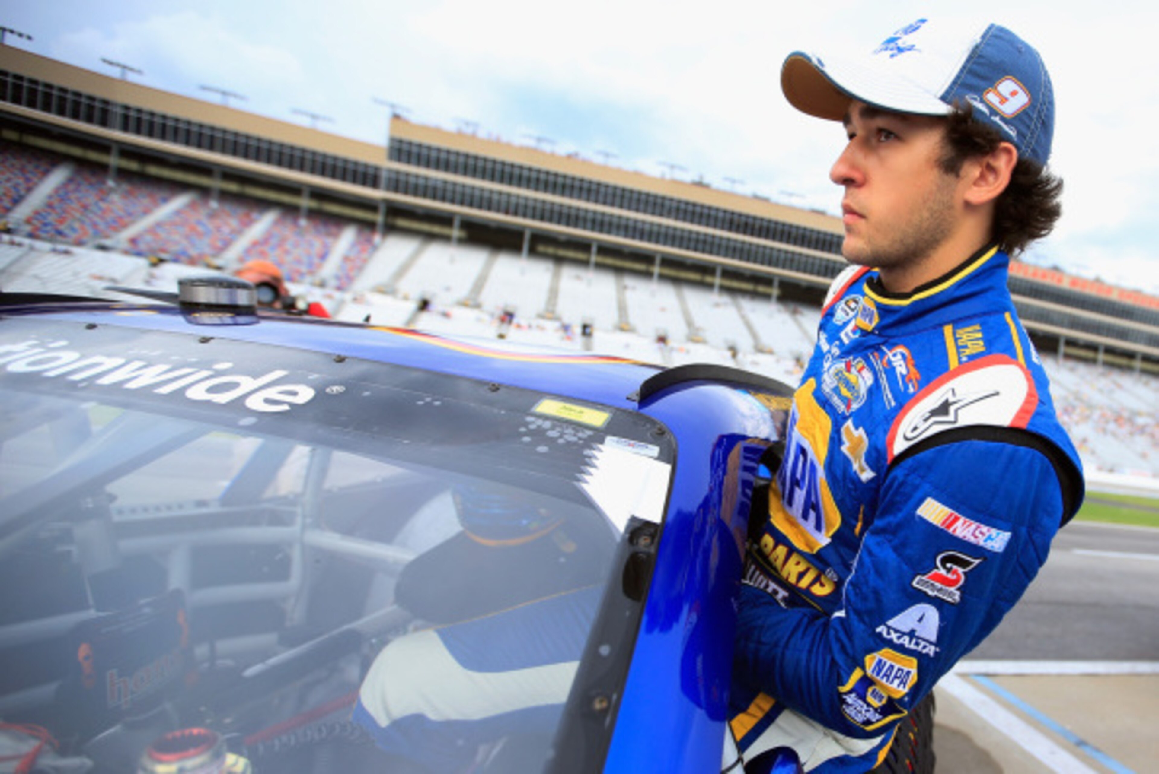 HAMPTON, GA - AUGUST 30: Chase Elliott, driver of the #9 NAPA AUTO PARTS Chevrolet, climbs into his car during qualifying for the NASCAR Nationwide Series Great Clips 300 at Atlanta Motor Speedway on August 30, 2014 in Hampton, Georgia.  (Photo by Jamie S