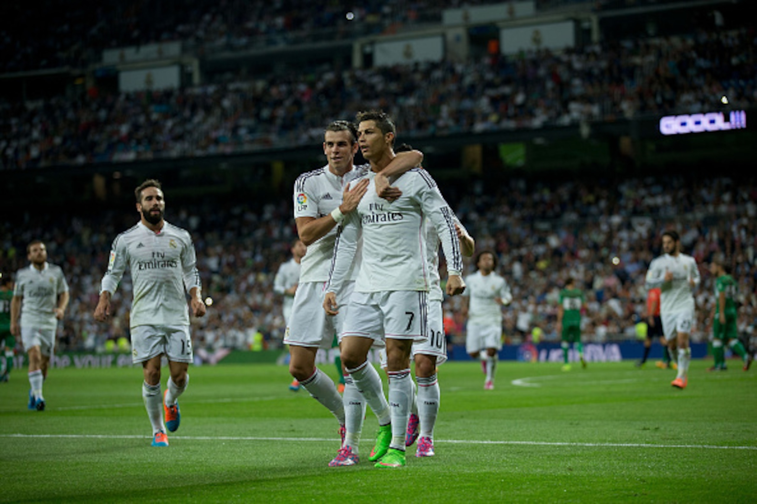 MADRID, SPAIN - SEPTEMBER 23:  Cristiano Ronaldo (R) of Real Madrid CF celebrates scoring their second goal with teammate Gareth Bale (L) during the La Liga match between Real Madrid CF and Elche CF at Estadio Santiago Bernabeu on September 23, 2014 in Ma