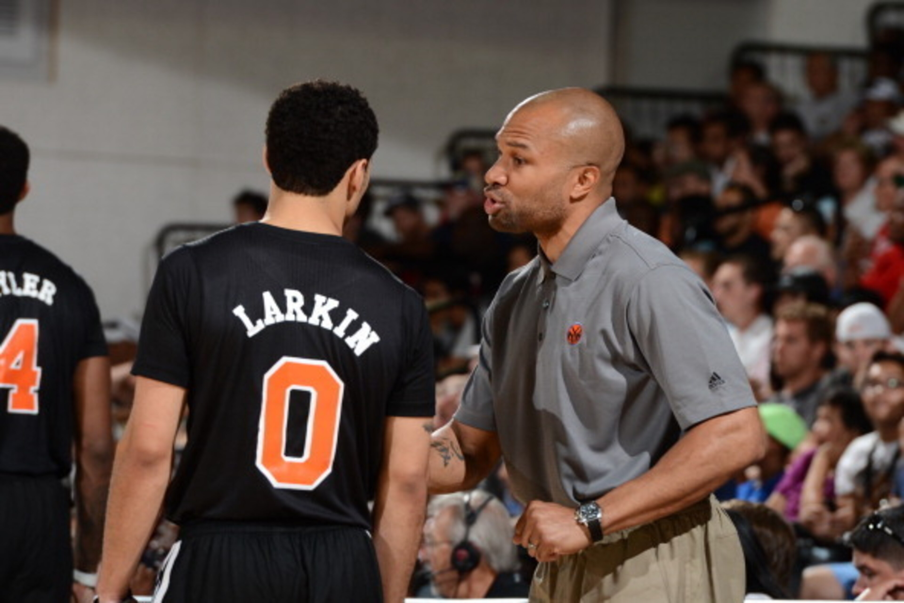 LAS VEGAS, NV - JULY 11: Head coach Derek Fisher of the New York Knicks speaks with Shane Larkin #0 against the Dallas Mavericks at the Samsung NBA Summer League 2014 on July 11, 2014 at the Cox Pavilion in Las Vegas, Nevada. NOTE TO USER: User expressly 