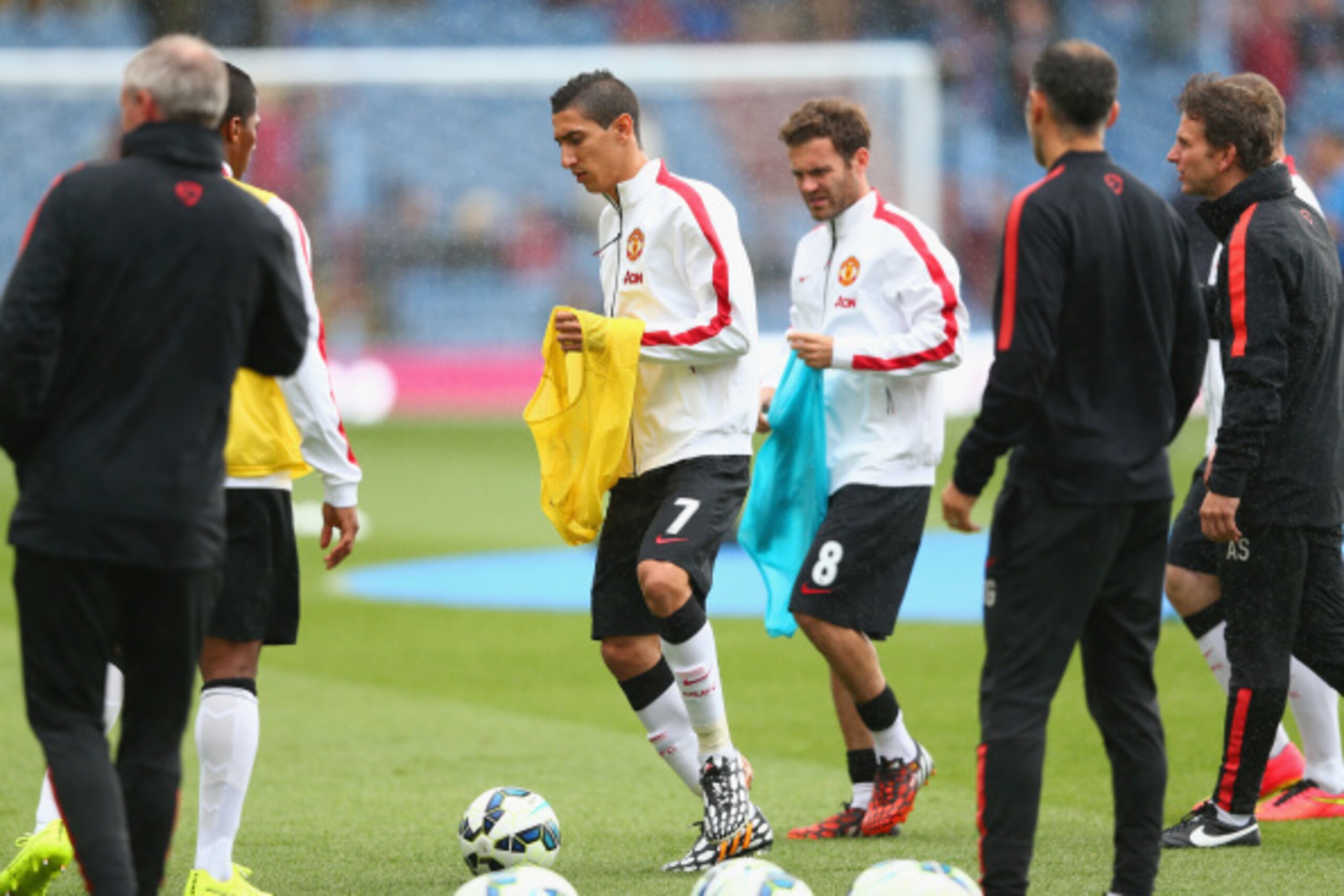 BURNLEY, ENGLAND - AUGUST 30:  Angel di Maria and Juan Mata of Manchester United warm up prior to the Barclays Premier League match between Burnley and Manchester United at Turf Moor on August 30, 2014 in Burnley, England.  (Photo by Clive Brunskill/Getty