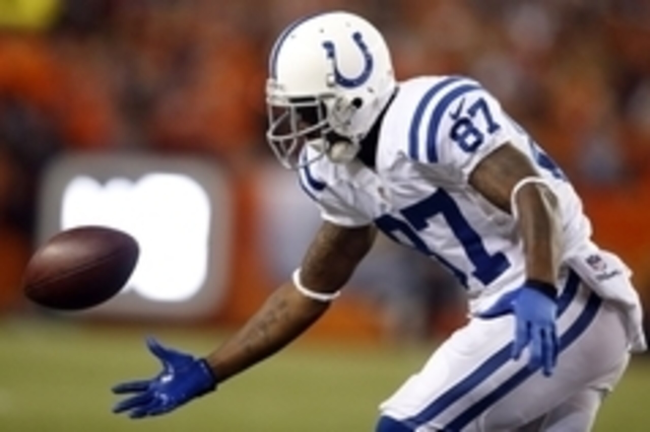 Sep 7, 2014; Denver, CO, USA; Indianapolis Colts wide receiver Reggie Wayne (87) can't hold onto the ball during the first half against the against the Denver Broncos at Sports Authority Field at Mile High. Mandatory Credit: Chris Humphreys-USA TODAY Spor