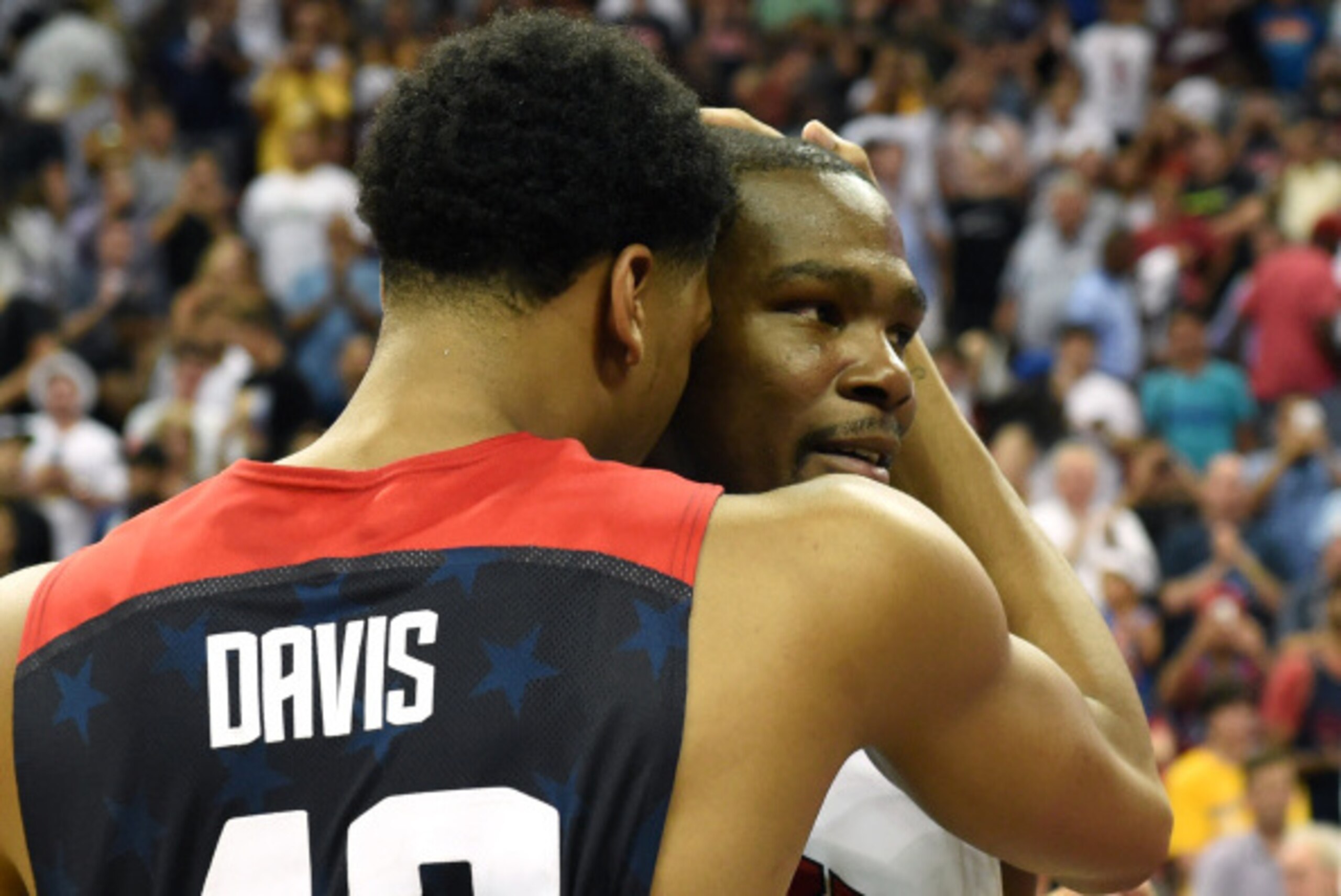 LAS VEGAS, NV - AUGUST 01:  Anthony Davis #42 and Kevin Durant #52 of the 2014 USA Basketball Men's National Team hug on the court after the game was called in the fourth quarter after an injury to Paul George during a USA Basketball showcase at the Thoma