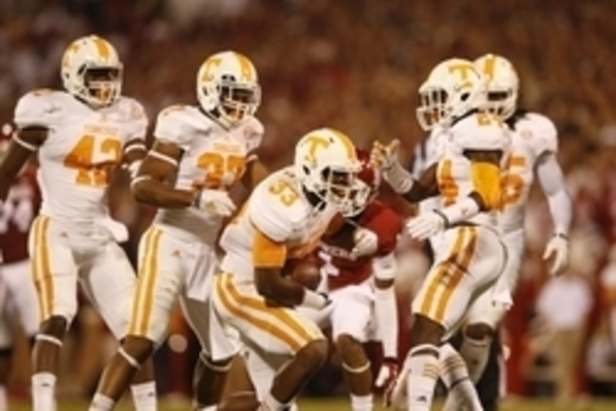 Sep 13, 2014; Norman, OK, USA; Tennessee Volunteers defensive back LaDarrell McNeil (33) celebrates with teammates after making an interception during the first half against the Oklahoma Sooners at Gaylord Family - Oklahoma Memorial Stadium. Mandatory Cre