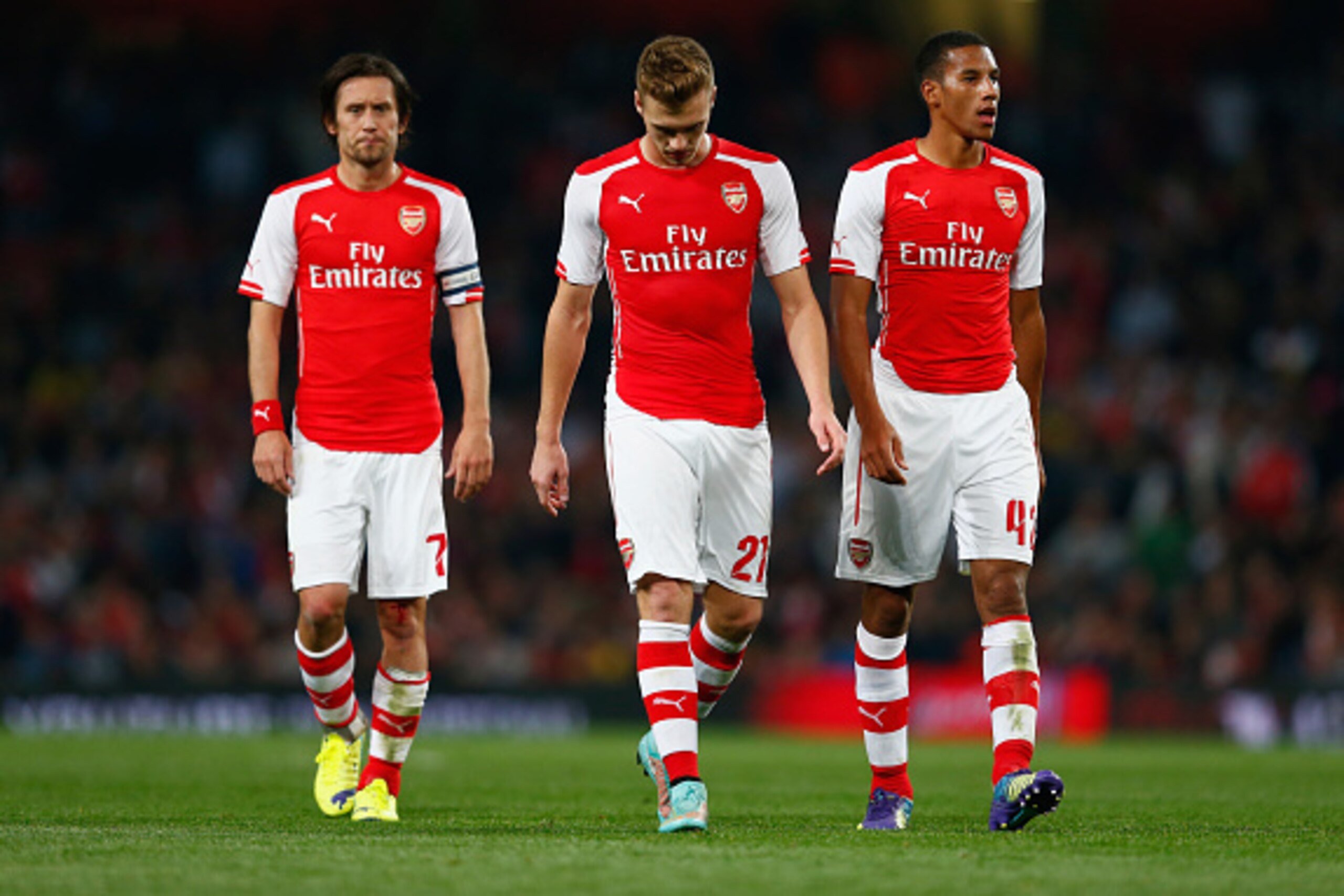 LONDON, ENGLAND - SEPTEMBER 23:  Tomas Rosicky of Arsenal, Calum Chambers of Arsenal and Isaac Hayden of Arsenal look down during the Capital One Cup Third Round match between Arsenal and Southampton at the Emirates Stadium on September 23, 2014 in London