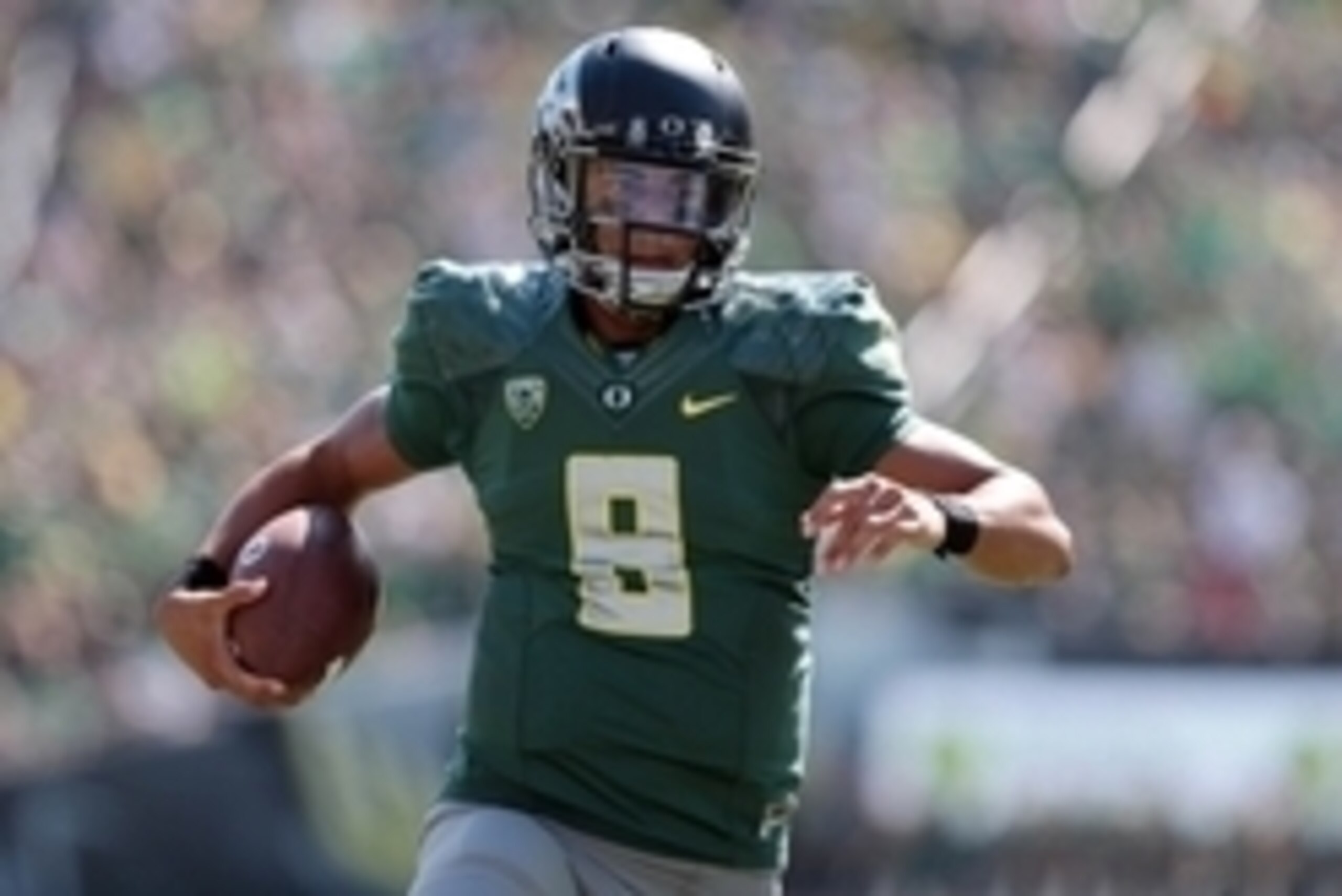 Sep 13, 2014; Eugene, OR, USA; Oregon Ducks quarterback Marcus Mariota (8) runs the ball for a touchdown in the second quarter against the Wyoming Cowboys at Autzen Stadium. Mandatory Credit: Scott Olmos-USA TODAY Sports