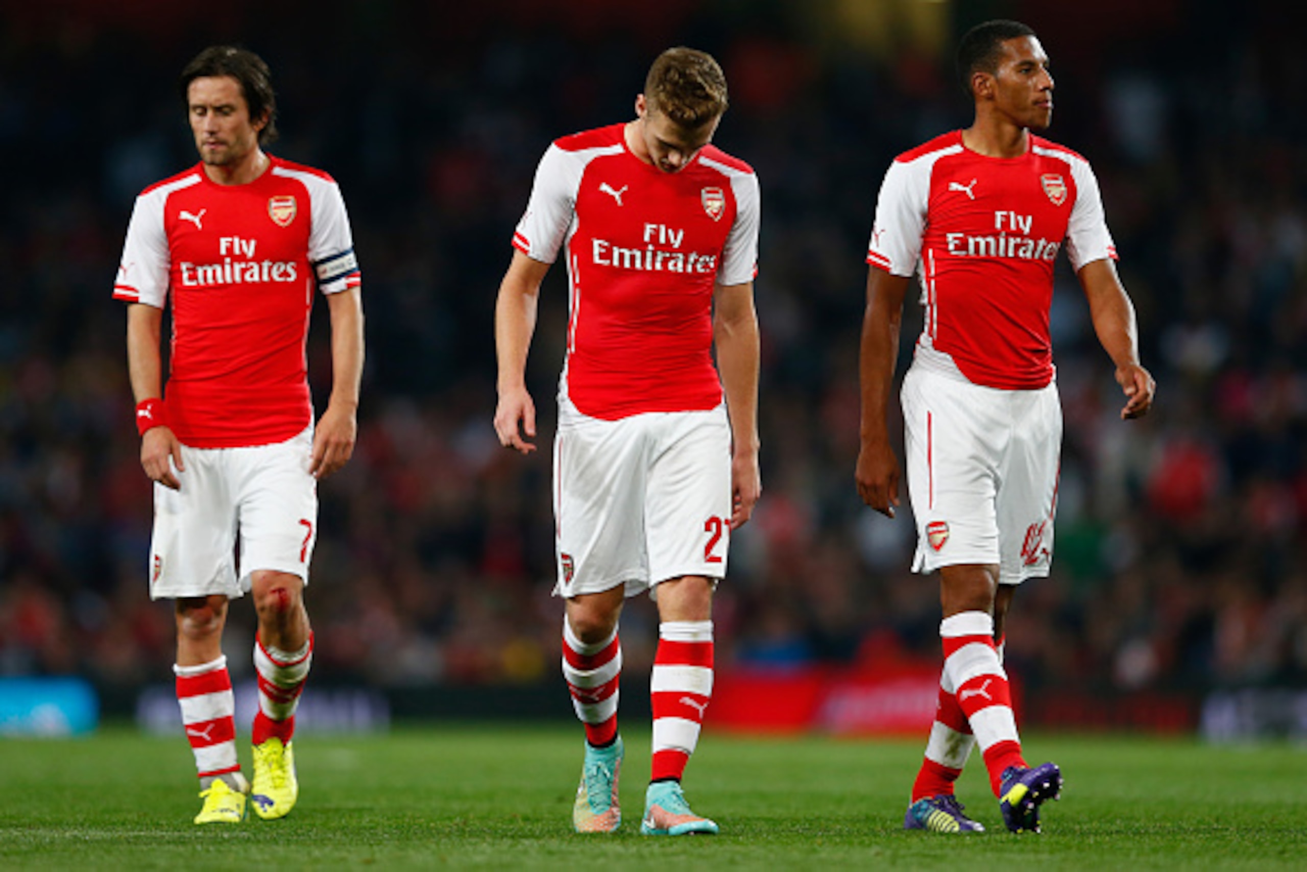 LONDON, ENGLAND - SEPTEMBER 23:  Tomas Rosicky of Arsenal, Calum Chambers of Arsenal and Isaac Hayden of Arsenal look down during the Capital One Cup Third Round match between Arsenal and Southampton at the Emirates Stadium on September 23, 2014 in London