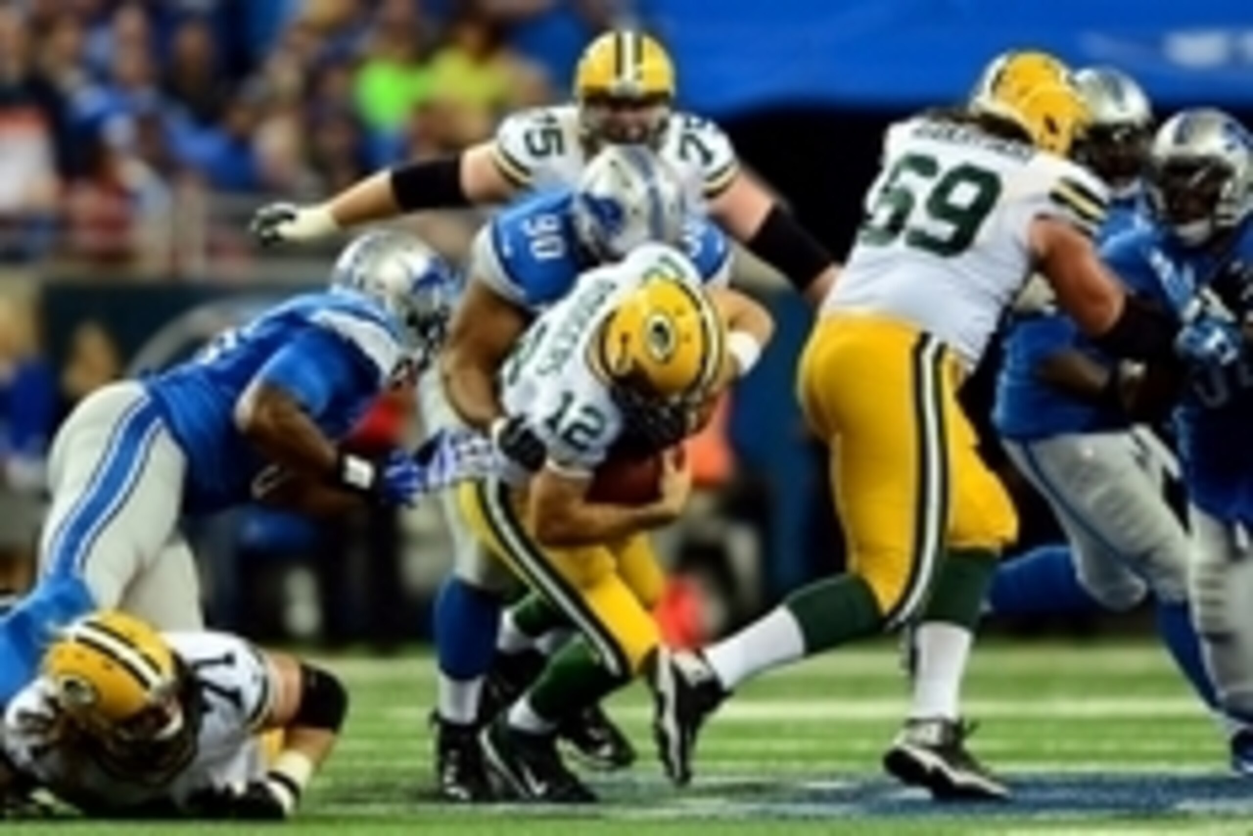 Sep 21, 2014; Detroit, MI, USA; Detroit Lions defensive tackle Ndamukong Suh (90) sacks Green Bay Packers quarterback Aaron Rodgers (12) during the second quarter at Ford Field. Mandatory Credit: Andrew Weber-USA TODAY Sports
