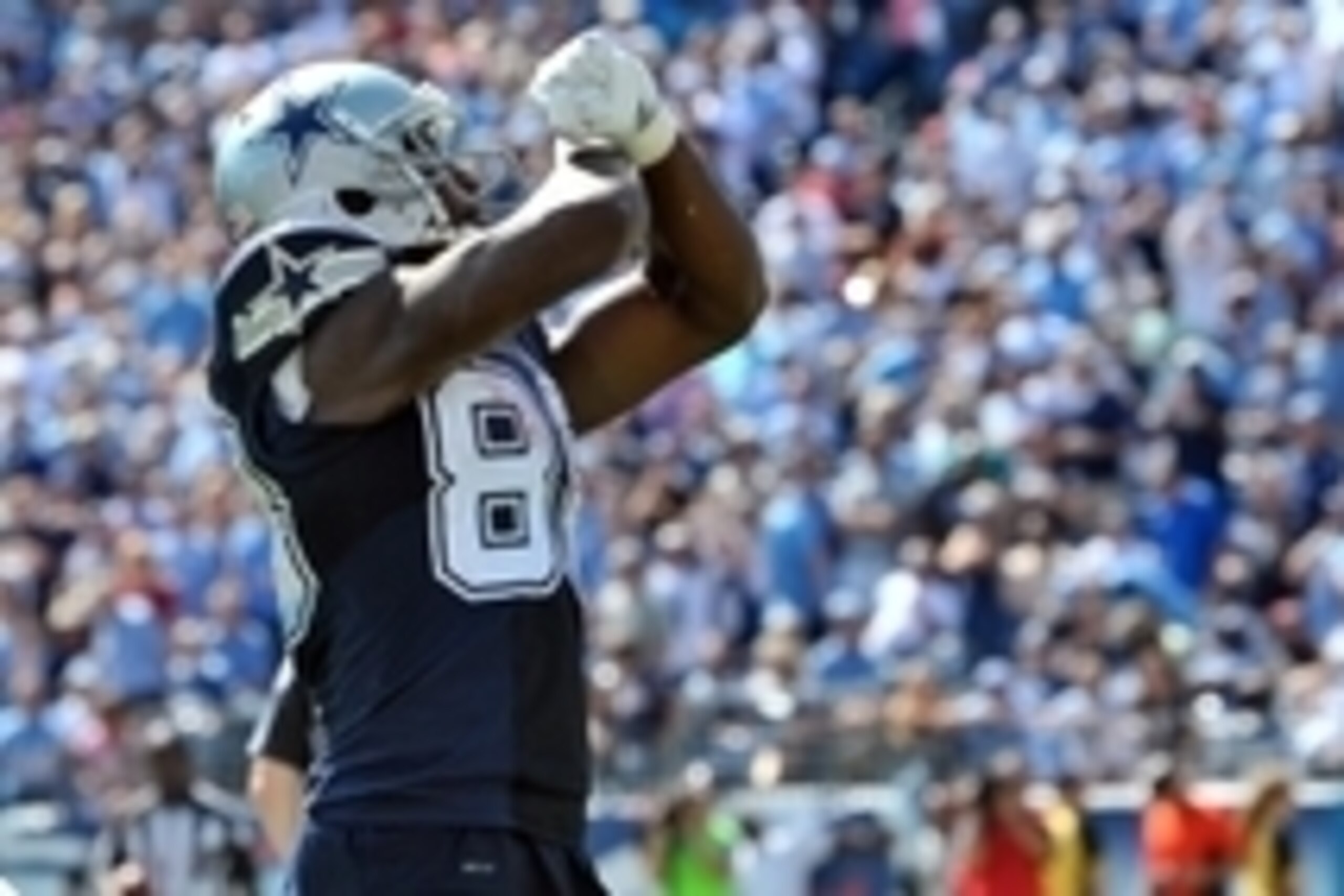 Sep 14, 2014; Nashville, TN, USA; Dallas Cowboys wide receiver Dez Bryant (88) jesters to the fans after scoring a touchdown against the Tennessee Titans during the second half at LP Field. Dallas won 26-10. Mandatory Credit: Jim Brown-USA TODAY Sports