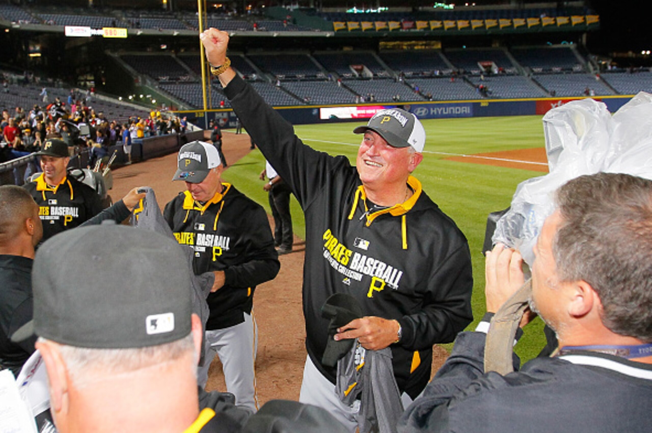 ATLANTA, GA - SEPTEMBER 23:  Clint Hurdle #13 of the Pittsburgh Pirates celebrates clinching a National League playoff spot after their 3-2 win over the Atlanta Braves at Turner Field on September 23, 2014 in Atlanta, Georgia.  (Photo by Kevin C. Cox/Gett