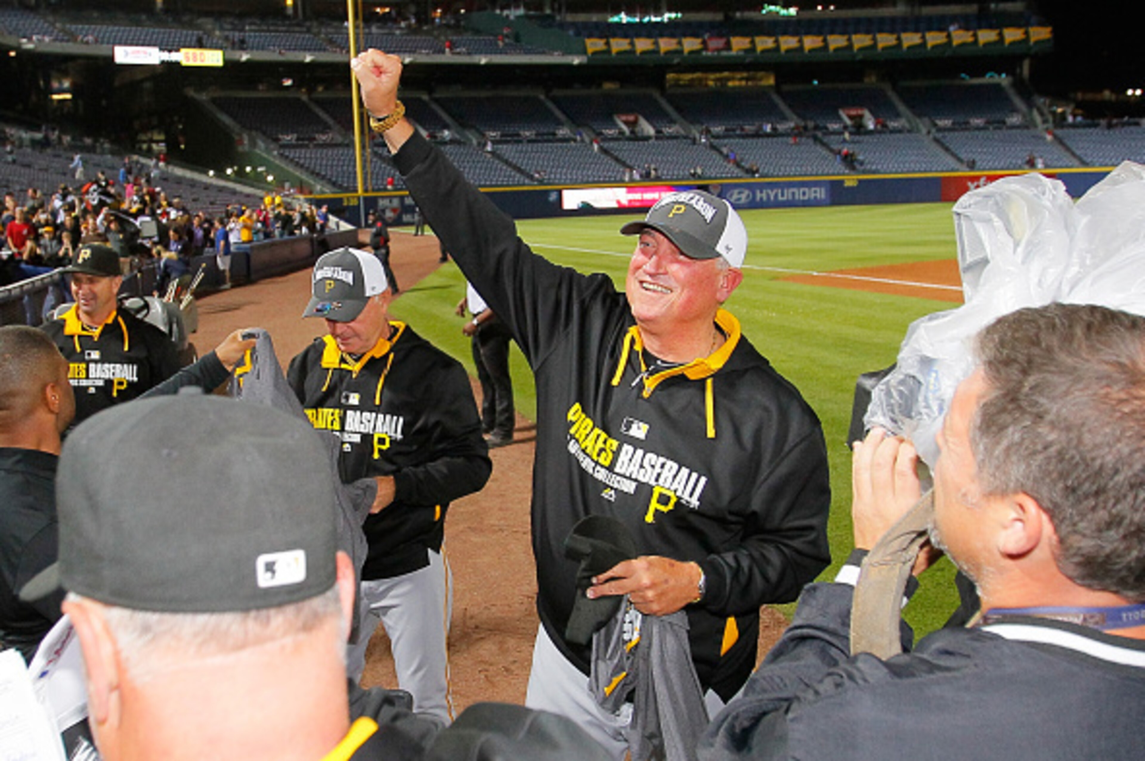 ATLANTA, GA - SEPTEMBER 23:  Clint Hurdle #13 of the Pittsburgh Pirates celebrates clinching a National League playoff spot after their 3-2 win over the Atlanta Braves at Turner Field on September 23, 2014 in Atlanta, Georgia.  (Photo by Kevin C. Cox/Gett