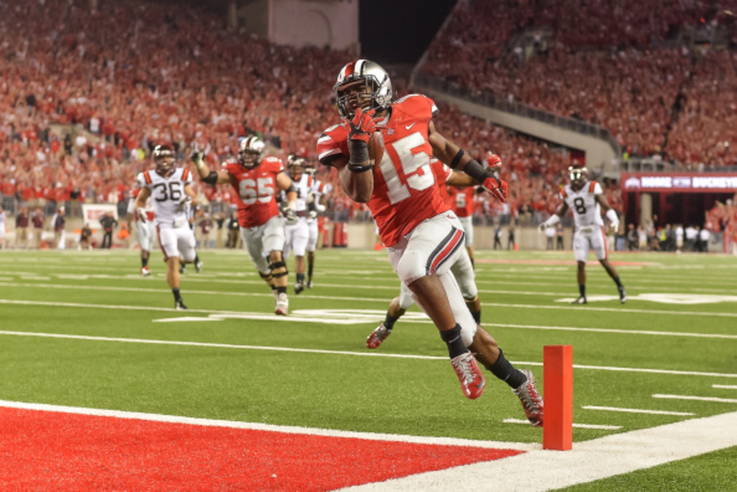 COLUMBUS, OH - SEPTEMBER 6:  Ezekiel Elliott #15 of the Ohio State Buckeyes runs with the ball  against the Virginia Tech Hokies at Ohio Stadium on September 6, 2014 in Columbus, Ohio.  (Photo by Jamie Sabau/Getty Images)