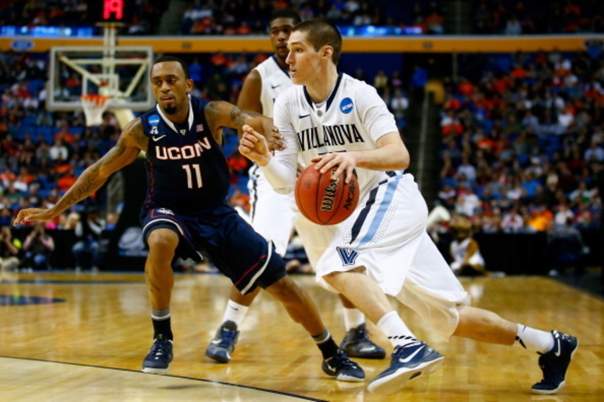 BUFFALO, NY - MARCH 22: Ryan Arcidiacono #15 of the Villanova Wildcats drives to the basket as Ryan Boatright #11 of the Connecticut Huskies defends during the third round of the 2014 NCAA Men's Basketball Tournament at the First Niagara Center on March BUFFALO, NY - MARCH 22: Ryan Arcidiacono #15 of the Villanova Wildcats drives to the basket as Ryan Boatright #11 of the Connecticut Huskies defends during the third round of the 2014 NCAA Men's Basketball Tournament at the First Niagara Center on March