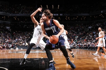 NEW YORK, NY - MARCH 19: Josh McRoberts #11 of the Charlotte Bobcats drives against the Brooklyn Nets at the Barclays Center on March 19, 2014 in the Brooklyn borough of New York City in New York City. NOTE TO USER: User expressly acknowledges and agrees 