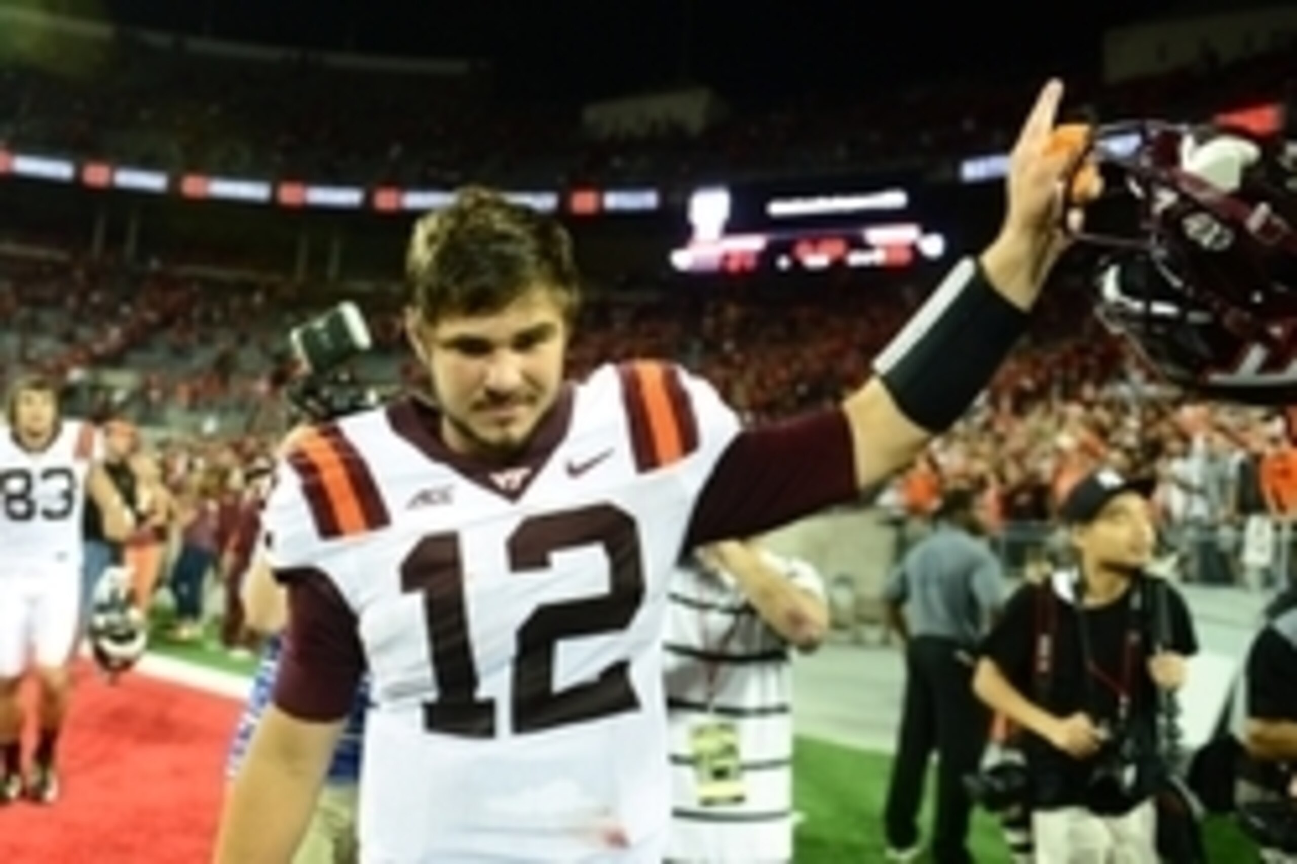 Sep 6, 2014; Columbus, OH, USA; Virginia Tech Hokies quarterback Michael Brewer (12) celebrates after defeating the Ohio State Buckeyes 35-21at Ohio Stadium. Mandatory Credit: Andrew Weber-USA TODAY Sports Sep 6, 2014; Columbus, OH, USA; Virginia Tech Hokies quarterback Michael Brewer (12) celebrates after defeating the Ohio State Buckeyes 35-21at Ohio Stadium. Mandatory Credit: Andrew Weber-USA TODAY Sports
