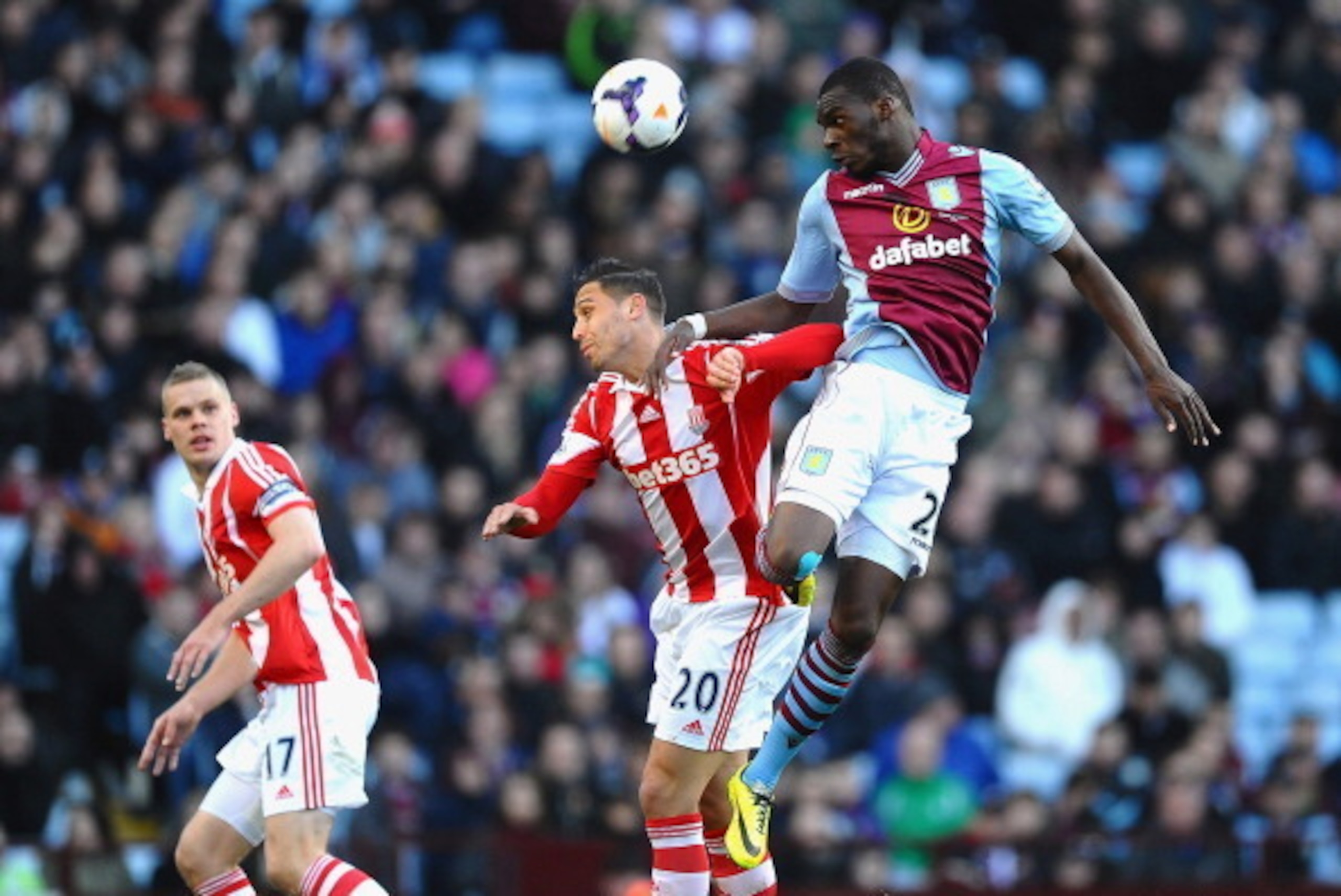BIRMINGHAM, ENGLAND - MARCH 23: Christian Benteke of Aston Villa rises above Geoff Cameron of Stoke to win a header during the Barclays Premier League match between Aston Villa and Stoke City at Villa Park on March 23, 2014 in Birmingham, England. (Phot BIRMINGHAM, ENGLAND - MARCH 23: Christian Benteke of Aston Villa rises above Geoff Cameron of Stoke to win a header during the Barclays Premier League match between Aston Villa and Stoke City at Villa Park on March 23, 2014 in Birmingham, England. (Phot