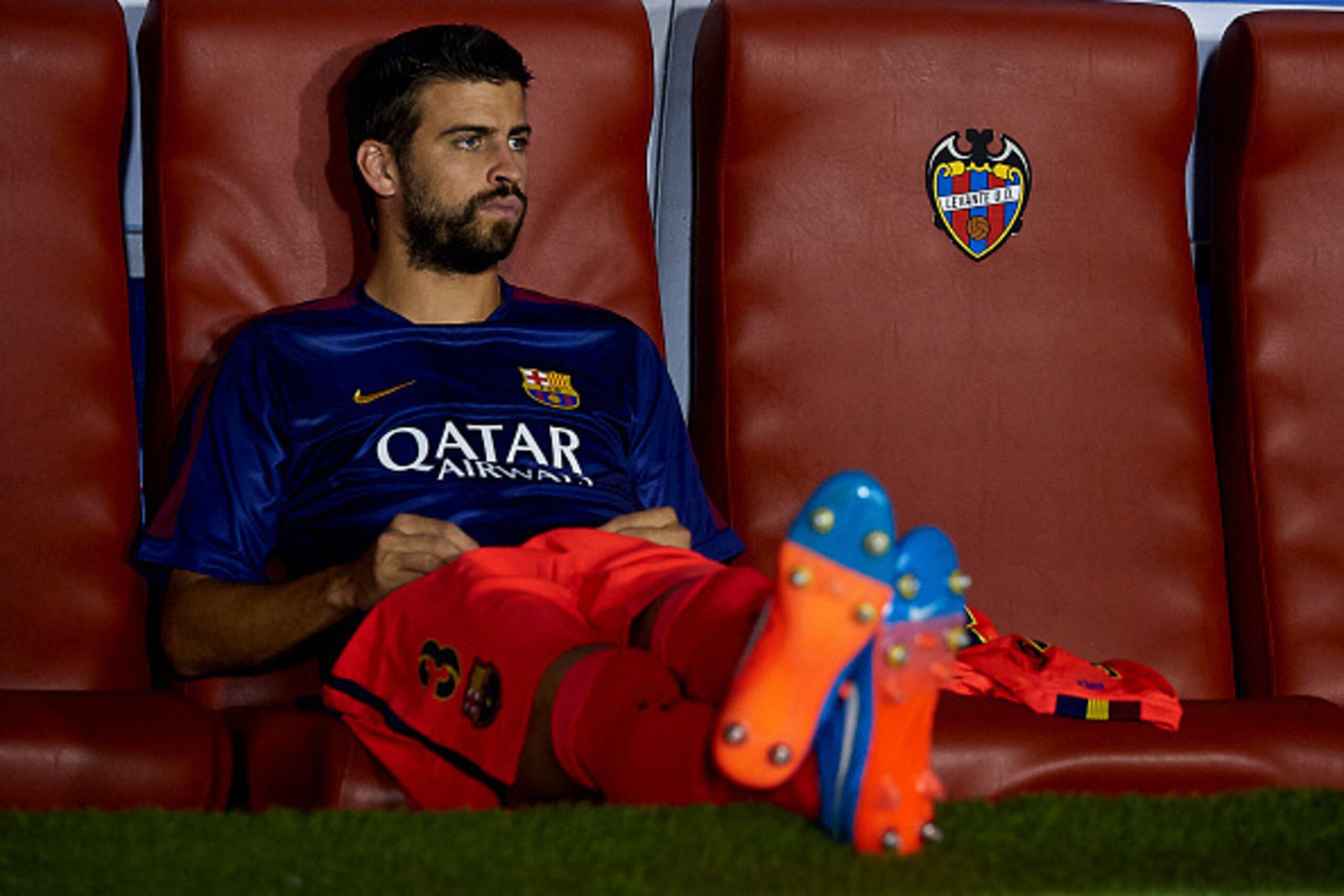VALENCIA, SPAIN - SEPTEMBER 21:  Gerard Pique of Barcelona watches from the subsitute bench prior to the La Liga match between Levante UD and FC Barcelona at Ciutat de Valencia on September 21, 2014 in Valencia, Spain.  (Photo by Manuel Queimadelos Alonso