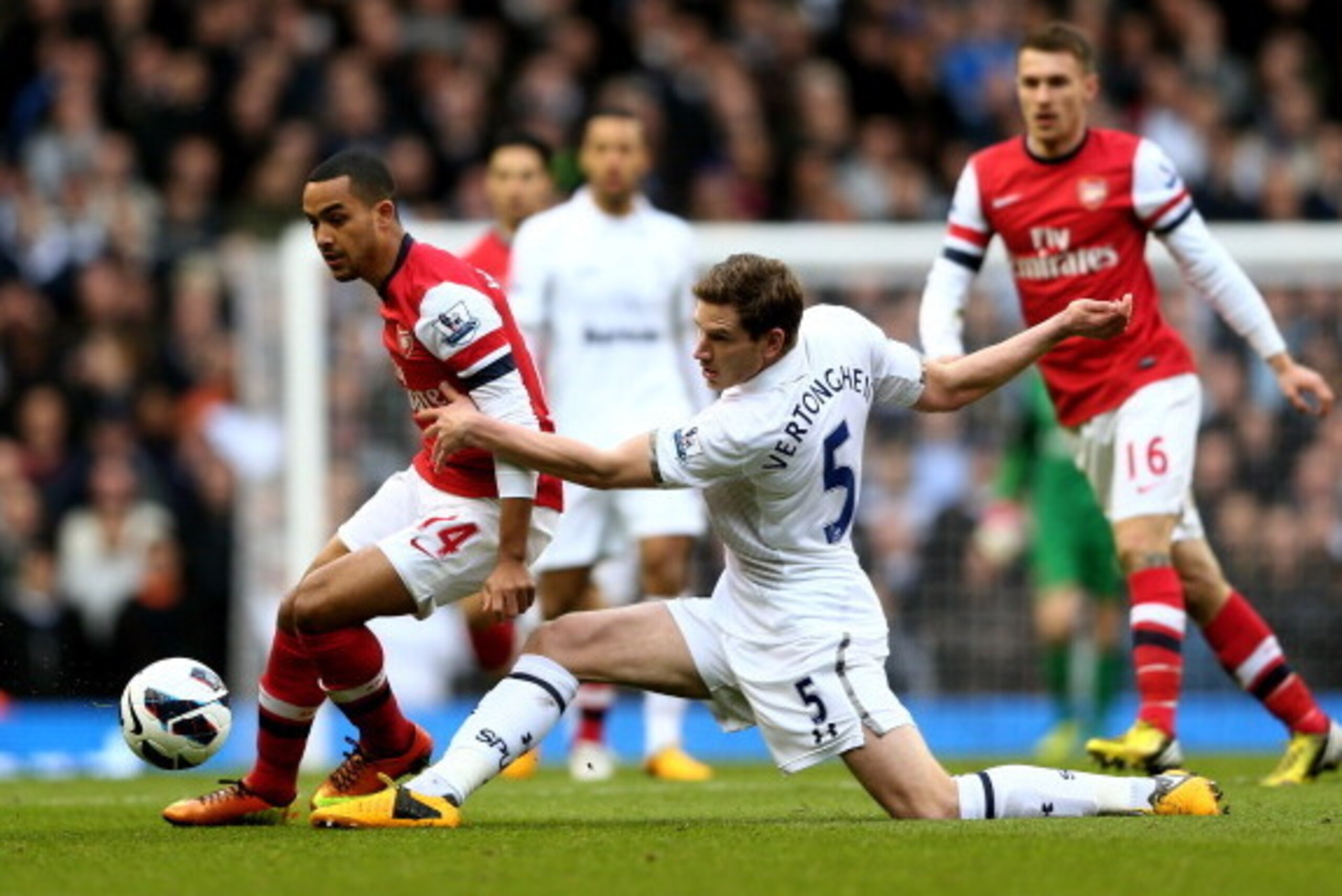 LONDON, ENGLAND - MARCH 03:  Theo Walcott of Arsenal is tackled by Jan Vertonghen of Spurs during the Barclays Premier League match between Tottenham Hotspur and Arsenal FC at White Hart Lane on March 3, 2013 in London, England.  (Photo by Paul Gilham/Get