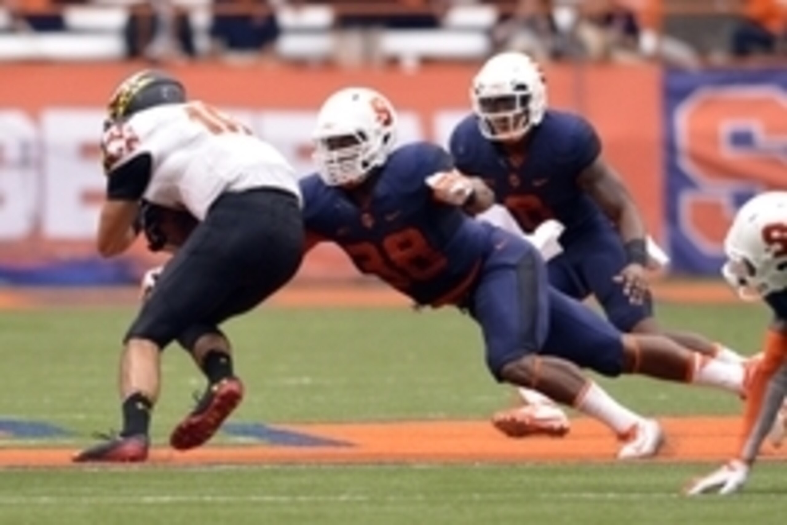 Sep 20, 2014; Syracuse, NY, USA; Syracuse Orange linebacker Cameron Lynch (38) makes a tackle on Maryland Terrapins quarterback C.J. Brown (16)  during the second half of a game at the Carrier Dome. Maryland won the game 34-20. Mandatory Credit: Mark Kone