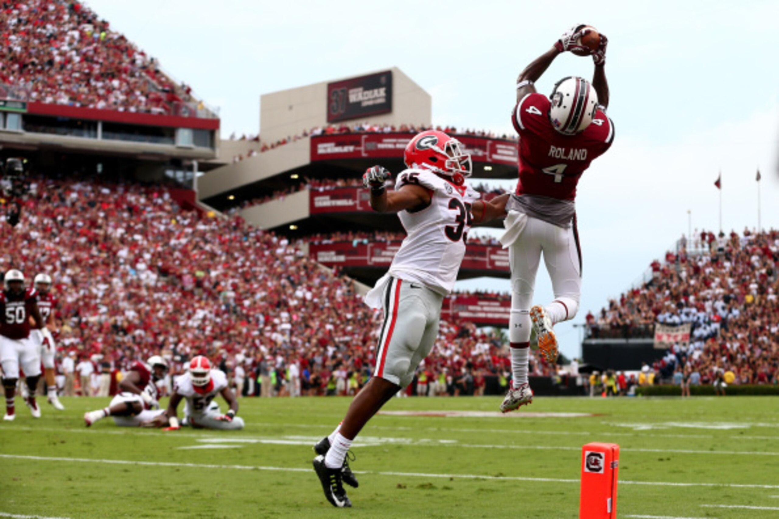 COLUMBIA, SC - SEPTEMBER 13:  Aaron Davis #35 of the Georgia Bulldogs watches as Shaq Roland #4 of the South Carolina Gamecocks catches a touchdown during their game at Williams-Brice Stadium on September 13, 2014 in Columbia, South Carolina.  (Photo by S