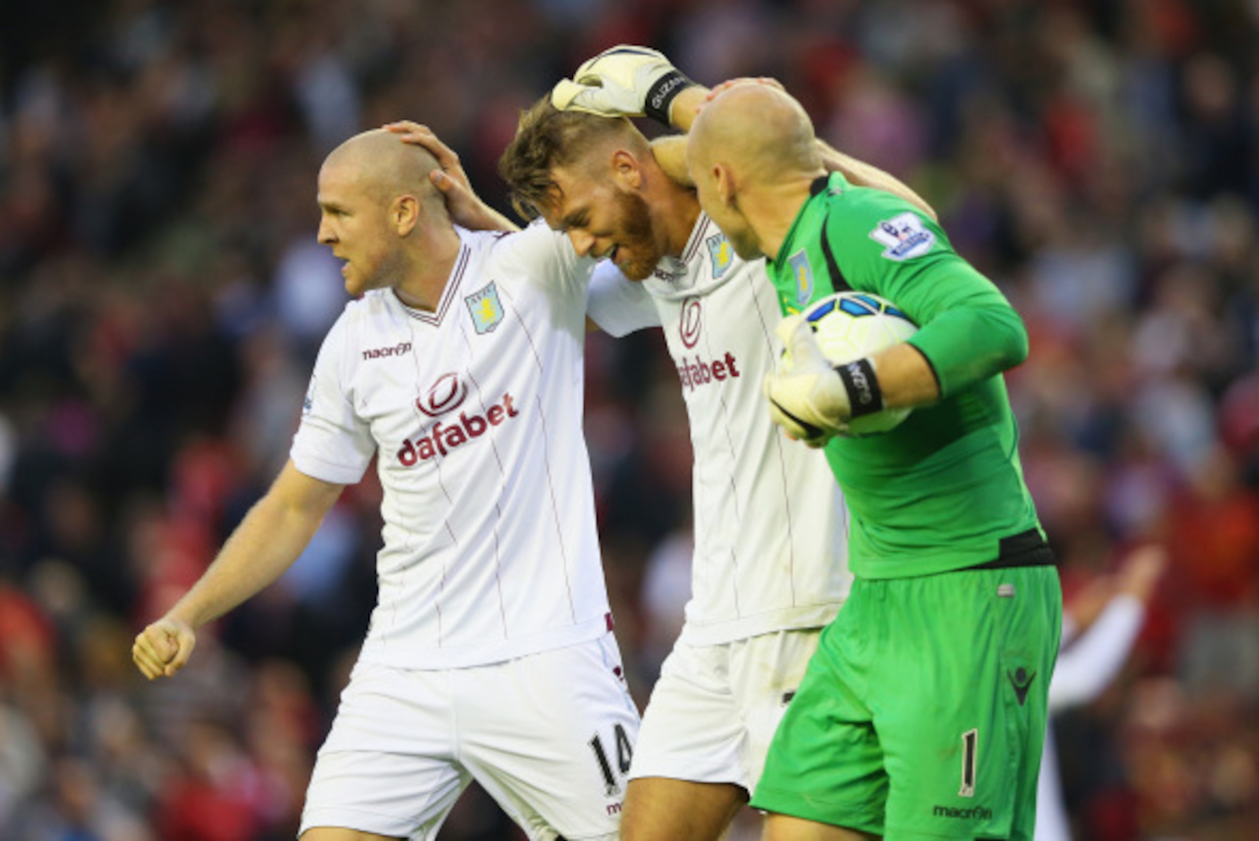 LIVERPOOL, ENGLAND - SEPTEMBER 13:  Philippe Senderos of Aston Villa celebrates victory with Nathan Baker (C) and Brad Guzan (R) after the Barclays Premier League match between Liverpool and Aston Villa at Anfield on September 13, 2014 in Liverpool, Engla