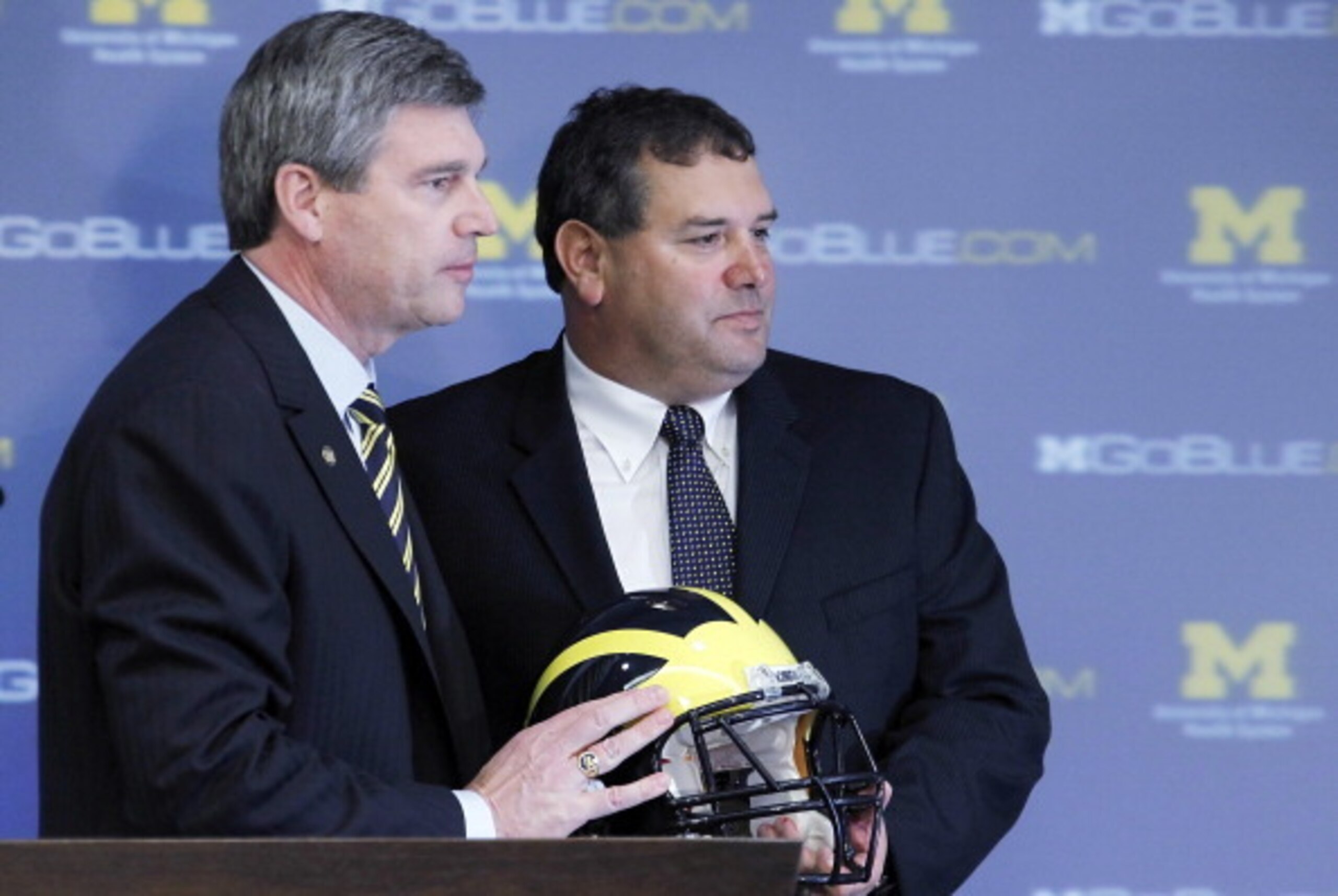 ANN ARBOR, MI - JANUARY 12:  New University of Michigan head football coach Brady Hoke (R) stands with Athletic Director Dave Brandon after being introduced to the media at the Junge Family Champions Center on January 12, 2011 in Ann Arbor, Michigan.  (Ph