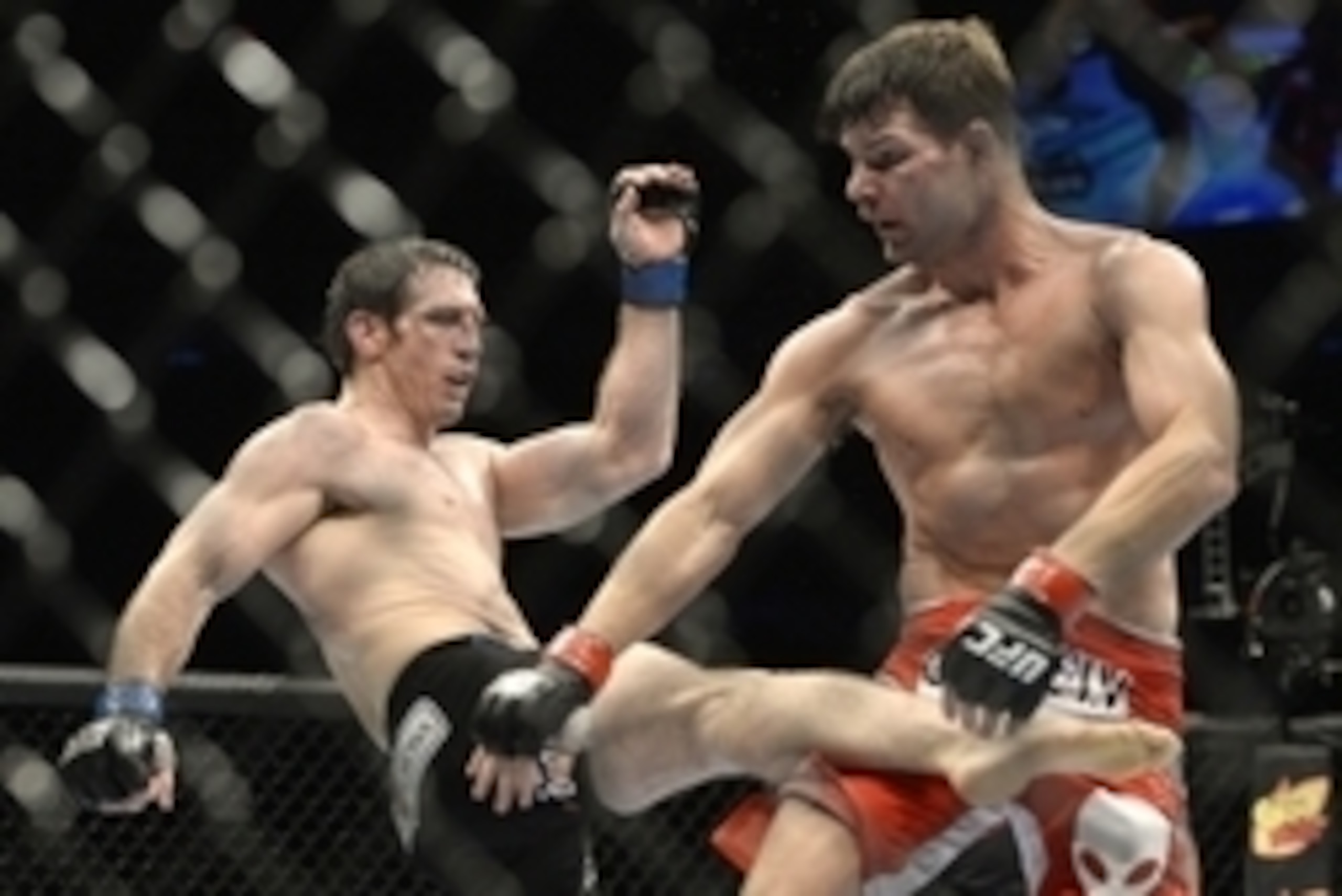 Apr 16, 2014; Quebec City, Quebec, Canada; Michael Bisping (red gloves) fights against Tim Kennedy (blue gloves) during their middleweight bout at Colisee Pepsi. Mandatory Credit: Eric Bolte-USA TODAY Sports