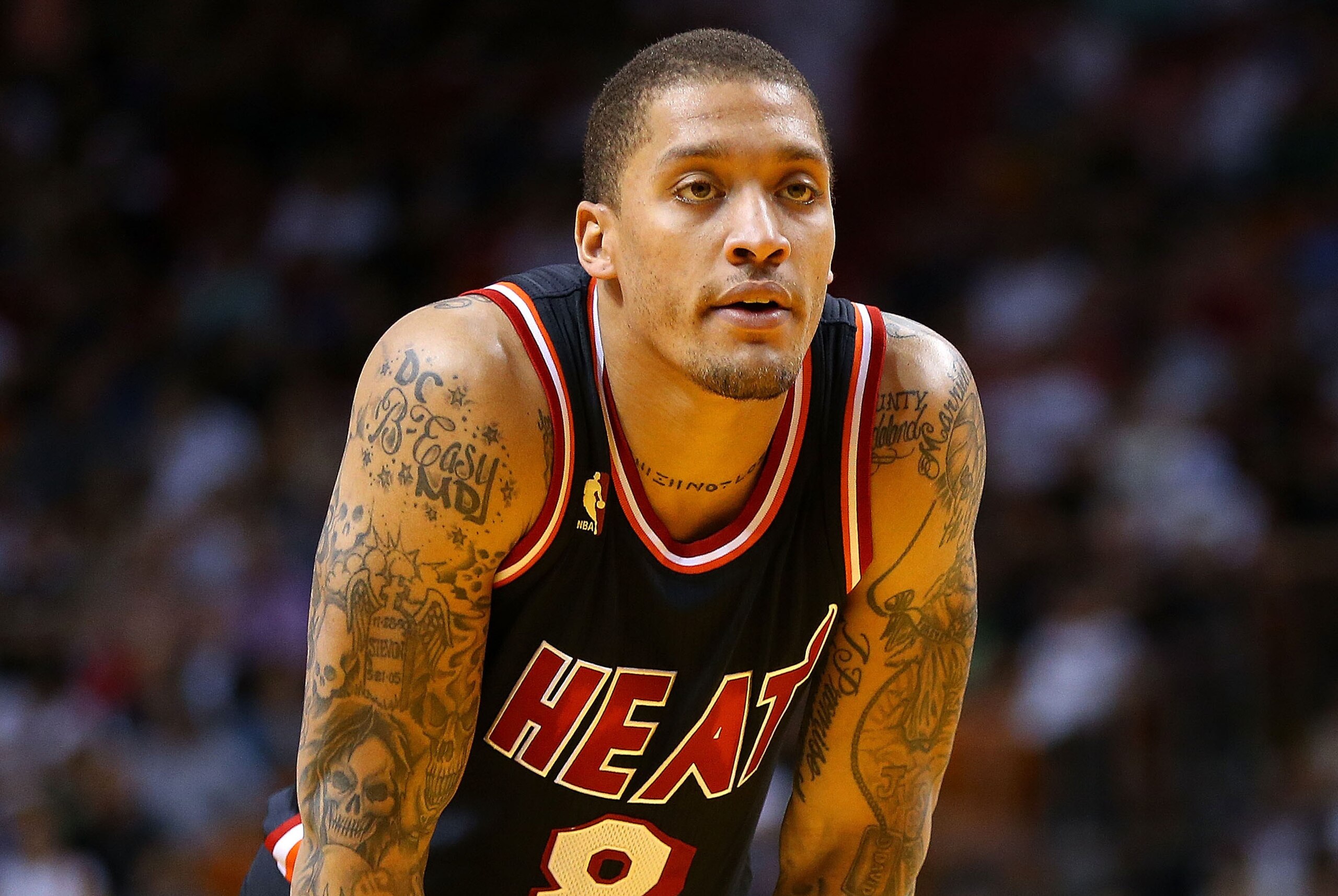 MIAMI, FL - JANUARY 26: Michael Beasley #8 of the Miami Heat looks on during a game against the San Antonio Spurs at American Airlines Arena on January 26, 2014 in Miami, Florida. NOTE TO USER: User expressly acknowledges and agrees that, by downloading a