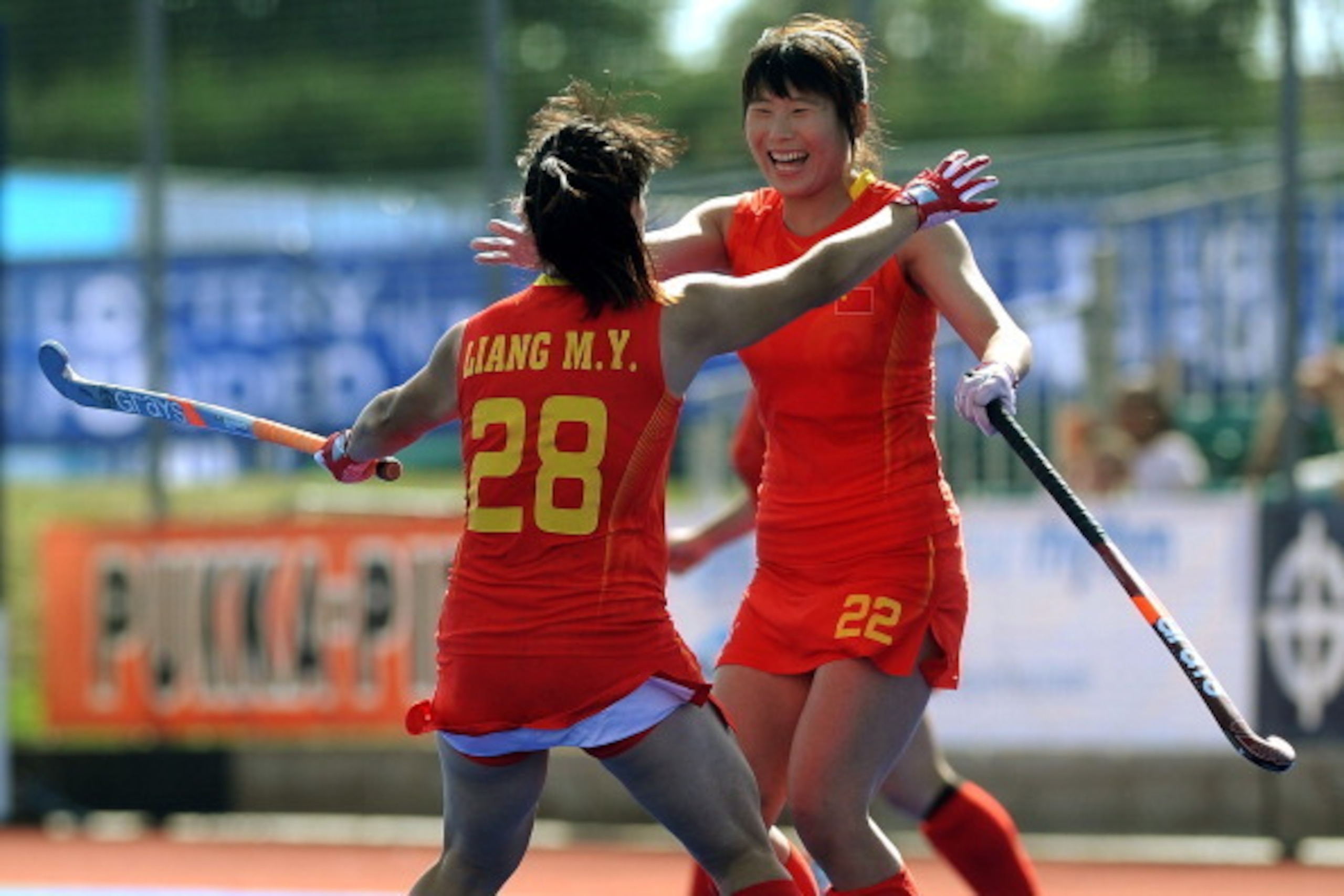 LONDON, ENGLAND - JUNE 30: Liang Meiyu celebrates scoring China's second goal with team mate Song Qingling during the Investec Hockey World League - Third place play off match between Argentina and China at The University of Westminster Sports Ground on J