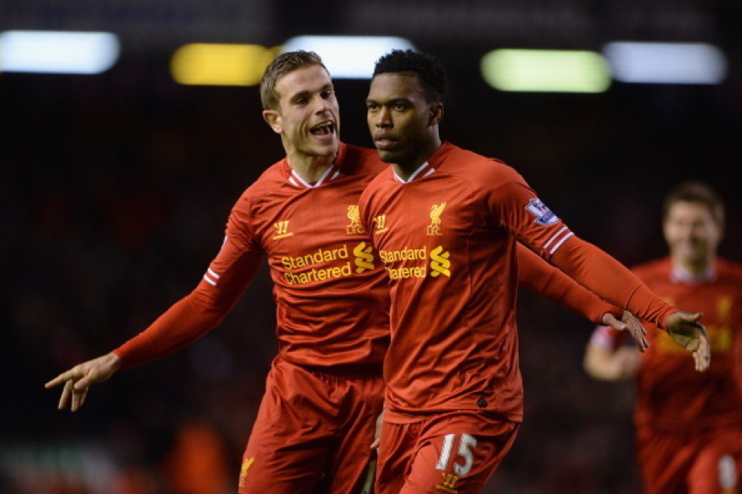 LIVERPOOL, ENGLAND - MARCH 26:  Daniel Sturridge of Liverpool celebrates scoring the second goal with team-mate Jordan Henderson (l) during the Barclays Premier League match between Liverpool and Sunderland at Anfield on March 26, 2014 in Liverpool, Engla