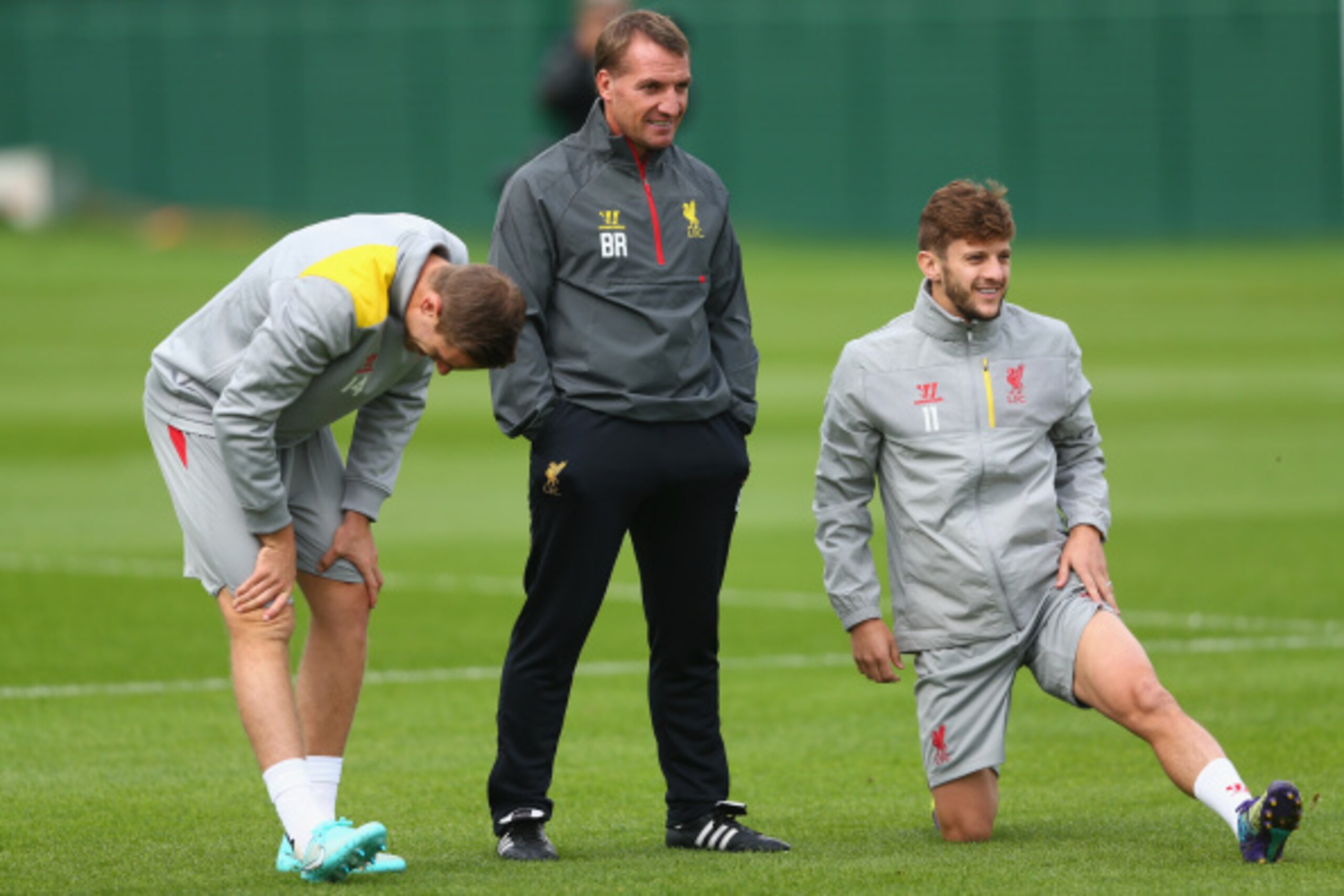 LIVERPOOL, ENGLAND - SEPTEMBER 15:  Liverpool manager Brendan Rodgers with L-R Jordan Henderson and Adam Lallana during a training session ahead of their UEFA Champions League group B match against PFC Ludogorets on September 15, 2014 in Liverpool, United