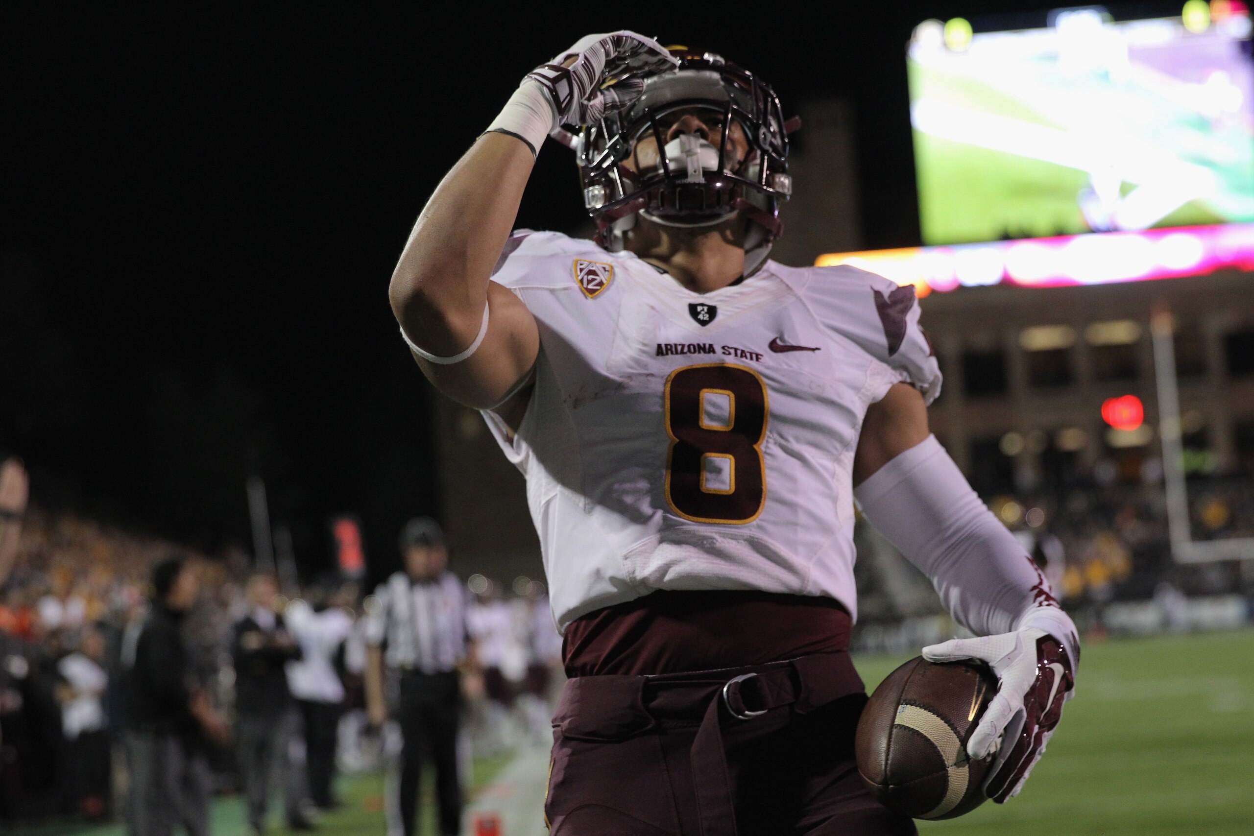 BOULDER, CO - SEPTEMBER 13: Running back D.J. Foster #8 of the Arizona State Sun Devils celebrates his 15 yard touchdown against the Colorado Buffaloes to give the Sun Devils a 7-0 lead in the first quarter at Folsom Field on September 13, 2014 in Boulde BOULDER, CO - SEPTEMBER 13: Running back D.J. Foster #8 of the Arizona State Sun Devils celebrates his 15 yard touchdown against the Colorado Buffaloes to give the Sun Devils a 7-0 lead in the first quarter at Folsom Field on September 13, 2014 in Boulde