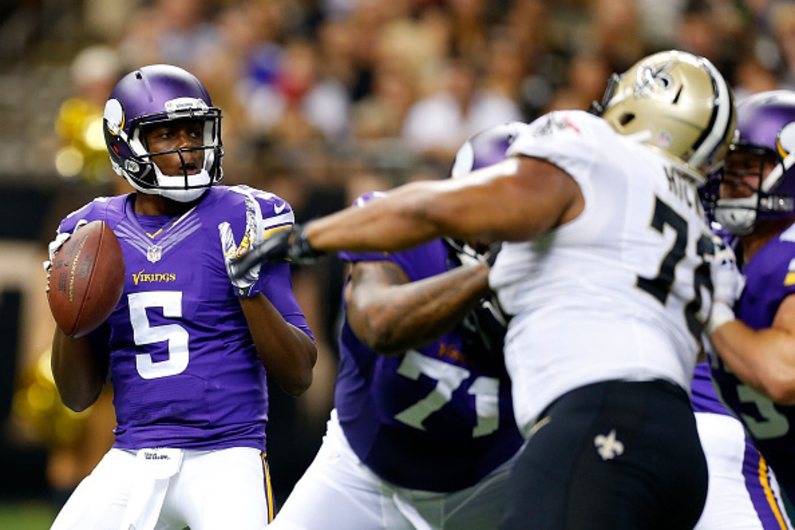 NEW ORLEANS, LA - SEPTEMBER 21:  Teddy Bridgewater #5 of the Minnesota Vikings drops back to pass against the New Orleans Saints during the second quarter of a game at the Mercedes-Benz Superdome on September 21, 2014 in New Orleans, Louisiana.  (Photo by