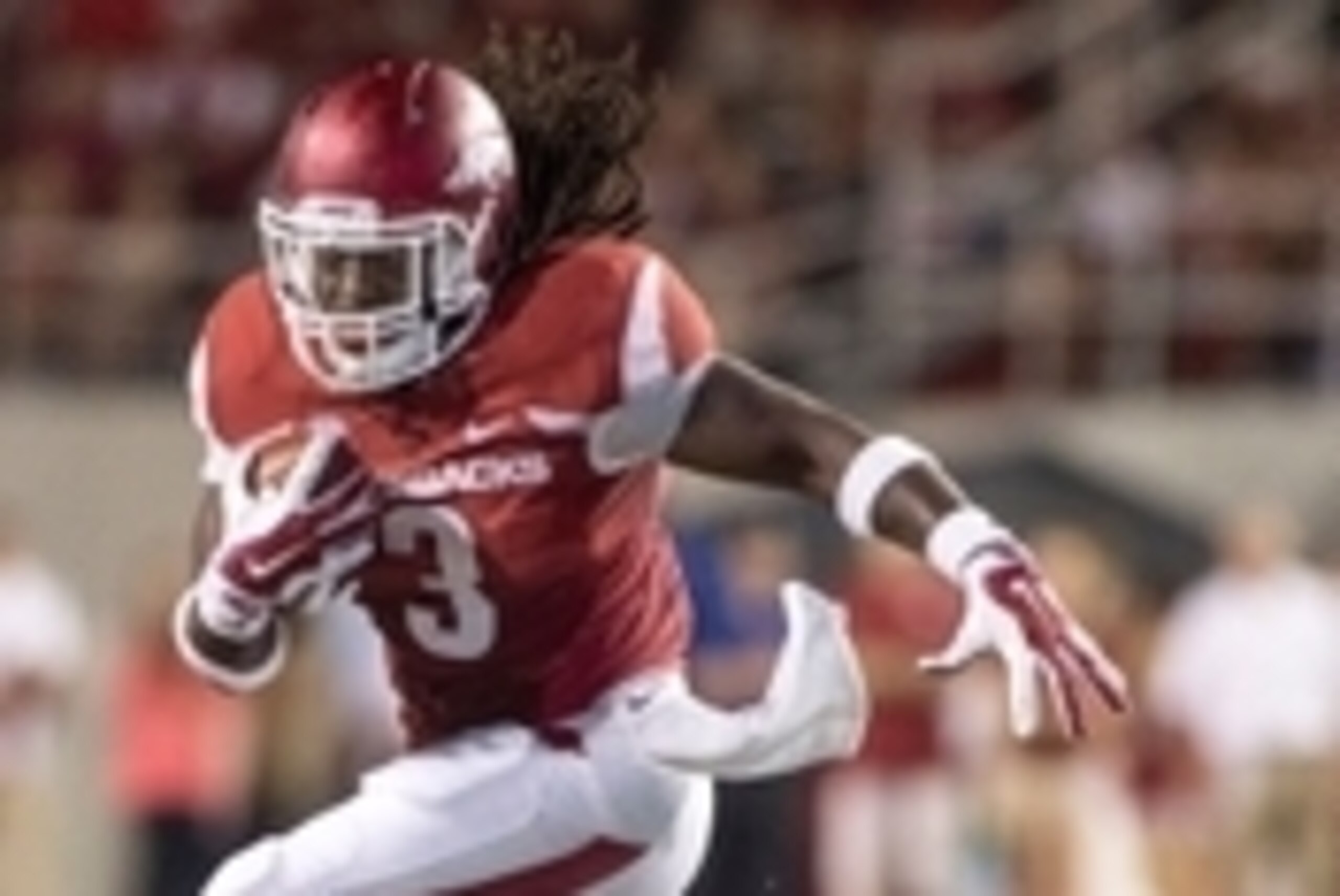 Sep 20, 2014; Fayetteville, AR, USA; Arkansas Razorbacks running back Alex Collins (3) carries the ball during the second half of a game against the Northern Illinois University Huskies at Donald W. Reynolds Razorback Stadium. Arkansas defeated NIU 52-14.