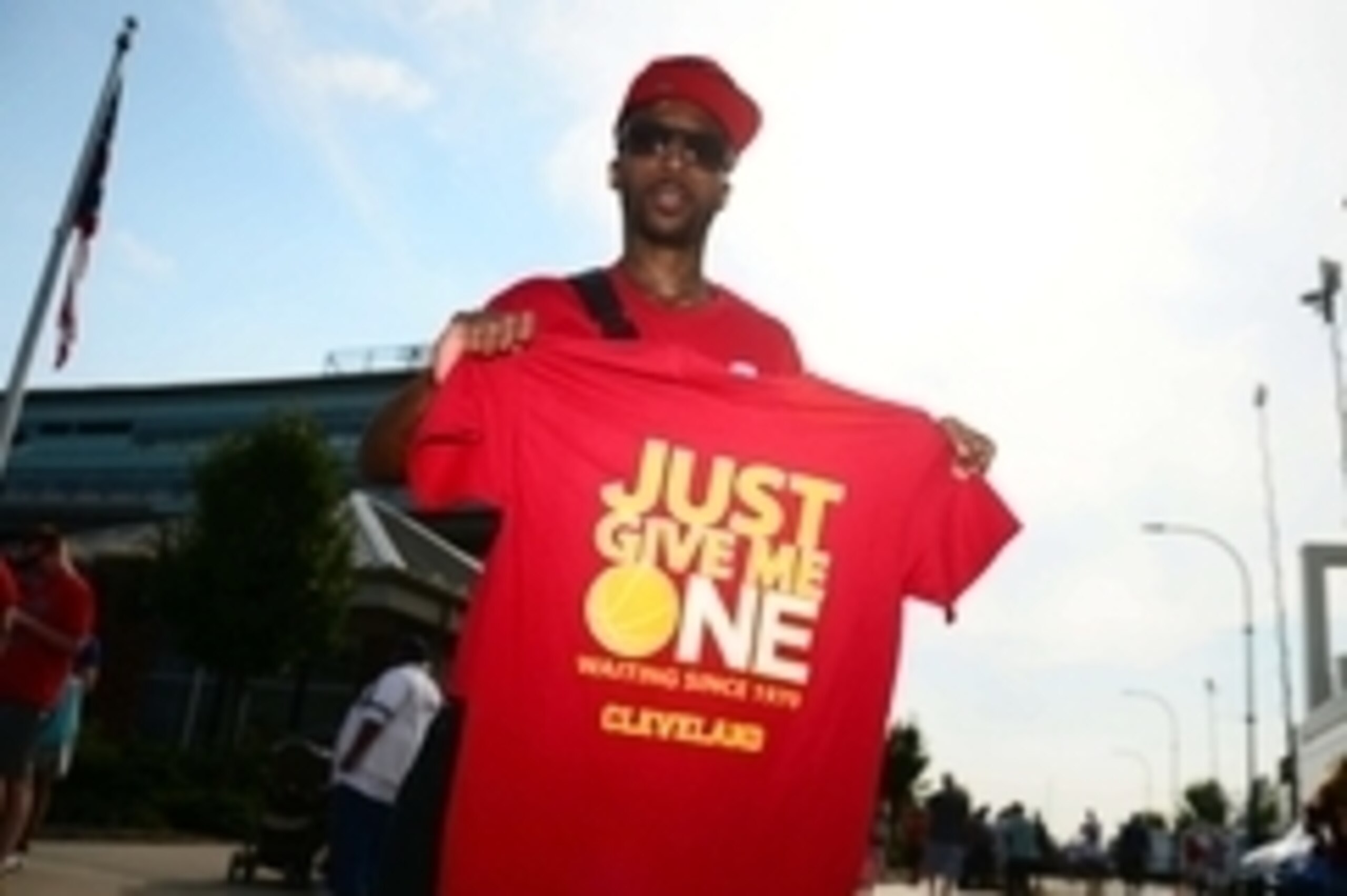 Aug 8, 2014; Akron, OH, USA; Cleveland Cavaliers fan Charlie Stevens sells tshirts prior to the LeBron James Family Foundation Reunion and Rally at InfoCision Stadium. Mandatory Credit: Andrew Weber-USA TODAY Sports Aug 8, 2014; Akron, OH, USA; Cleveland Cavaliers fan Charlie Stevens sells tshirts prior to the LeBron James Family Foundation Reunion and Rally at InfoCision Stadium. Mandatory Credit: Andrew Weber-USA TODAY Sports