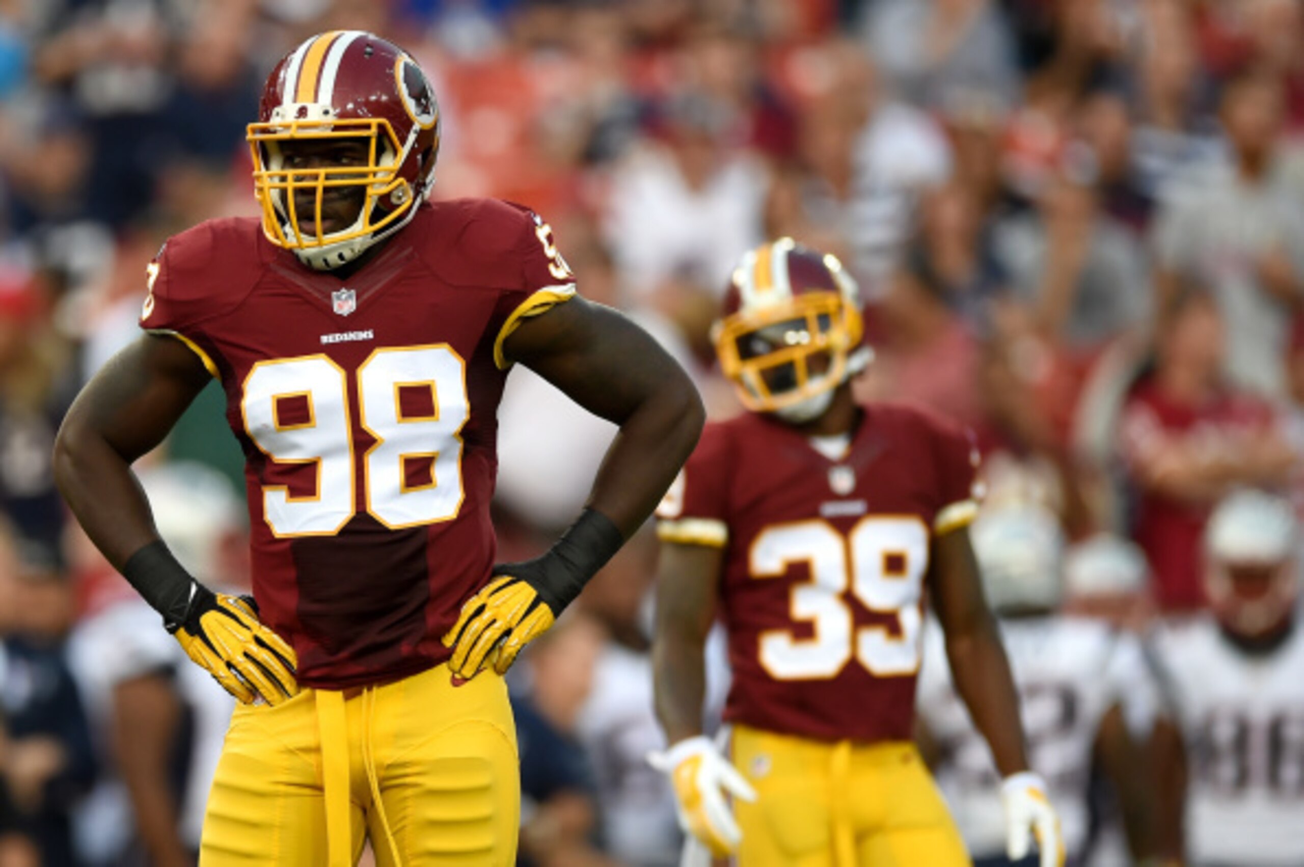 LANDOVER, MD - AUGUST 07: Outside linebacker Brian Orakpo #98 of the Washington Redskins looks on against the New England Patriots during a preseason NFL game at FedExField on August 7, 2014 in Landover, Maryland. The Washington Redskins won, 23-6. (Photo