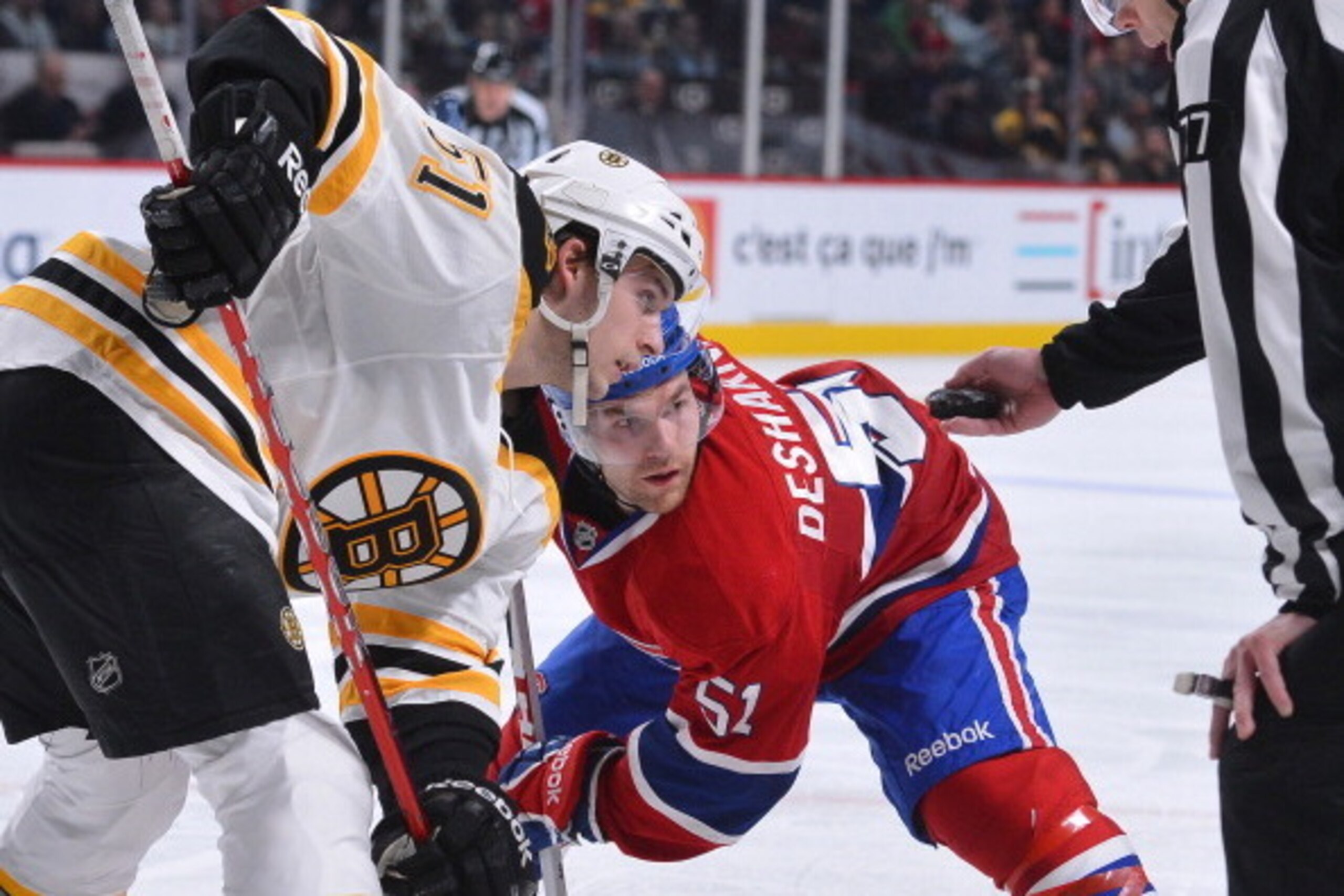 MONTREAL, CANADA - FEBRUARY 06: David Desharnais #51 of the Montreal Canadiens faces-off with Ryan Spooner #51 of the Boston Bruins during the NHL game on February 6, 2013 at the Bell Centre in Montreal, Quebec, Canada. (Photo by Francois Lacasse/NHLI via