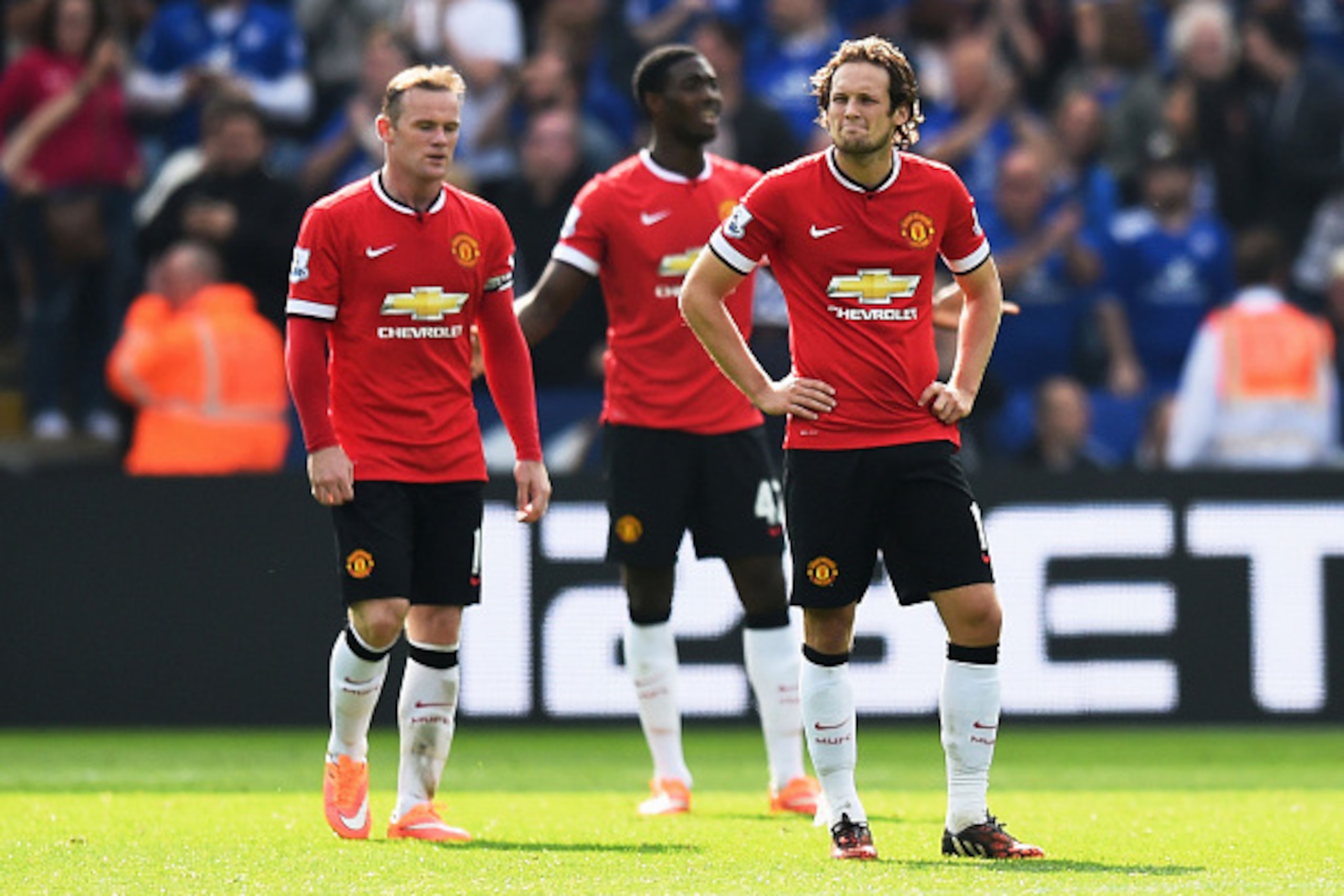 LEICESTER, ENGLAND - SEPTEMBER 21:  (L-R) Dejected Manchester United players Wayne Rooney, Tyler Blackett and Daley Blind look on during the Barclays Premier League match between Leicester City and Manchester United at The King Power Stadium on September 