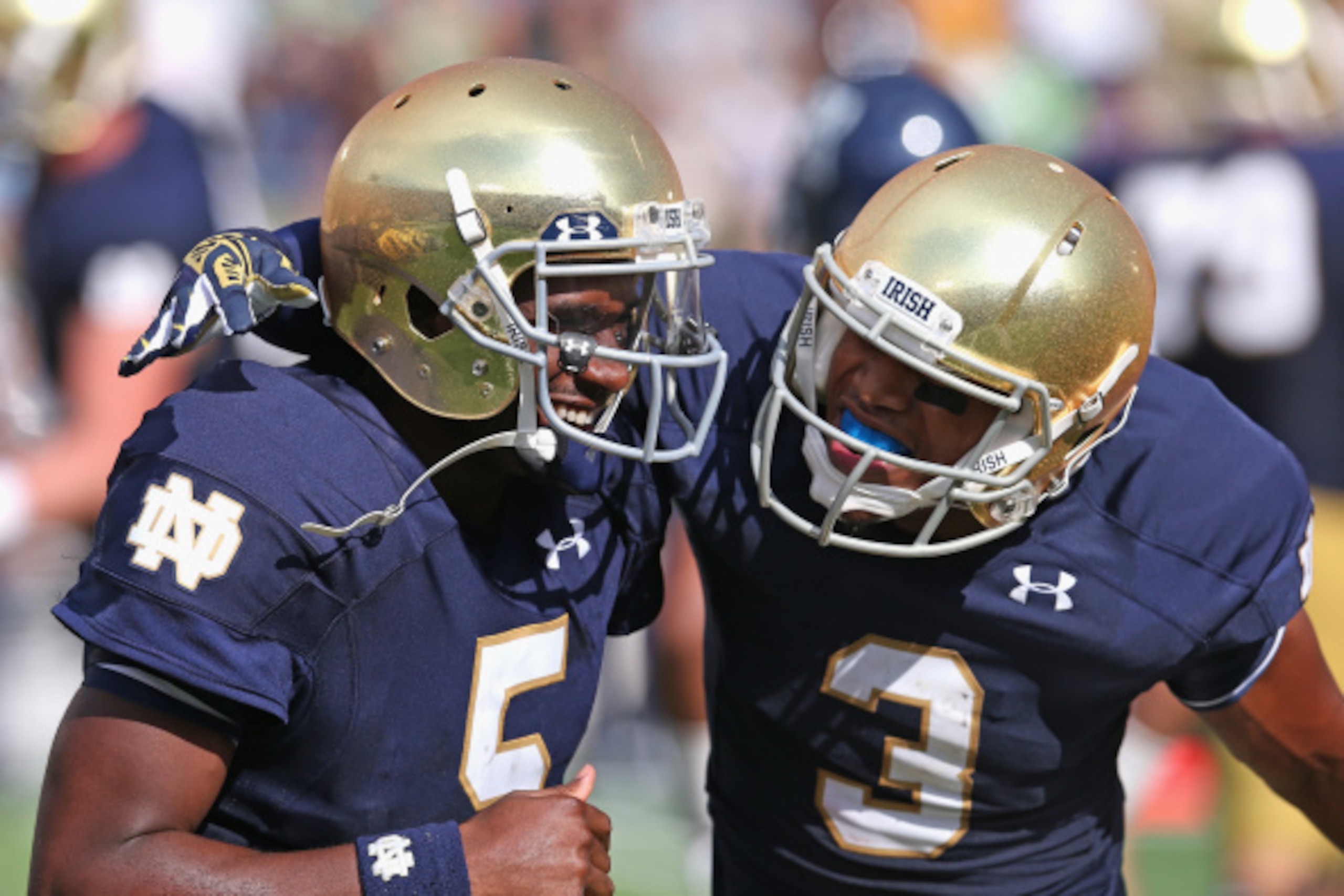 SOUTH BEND, IN - AUGUST 30:  Everett Golson #5 and Amir Carilisle #3 of the Norte Dame Fighting Irish celebrate Golson's second quarter touchdown against the Rice Owls at Notre Dame Stadium on August 30, 2014 in South Bend, Indiana. Notre Dame defeated Ri